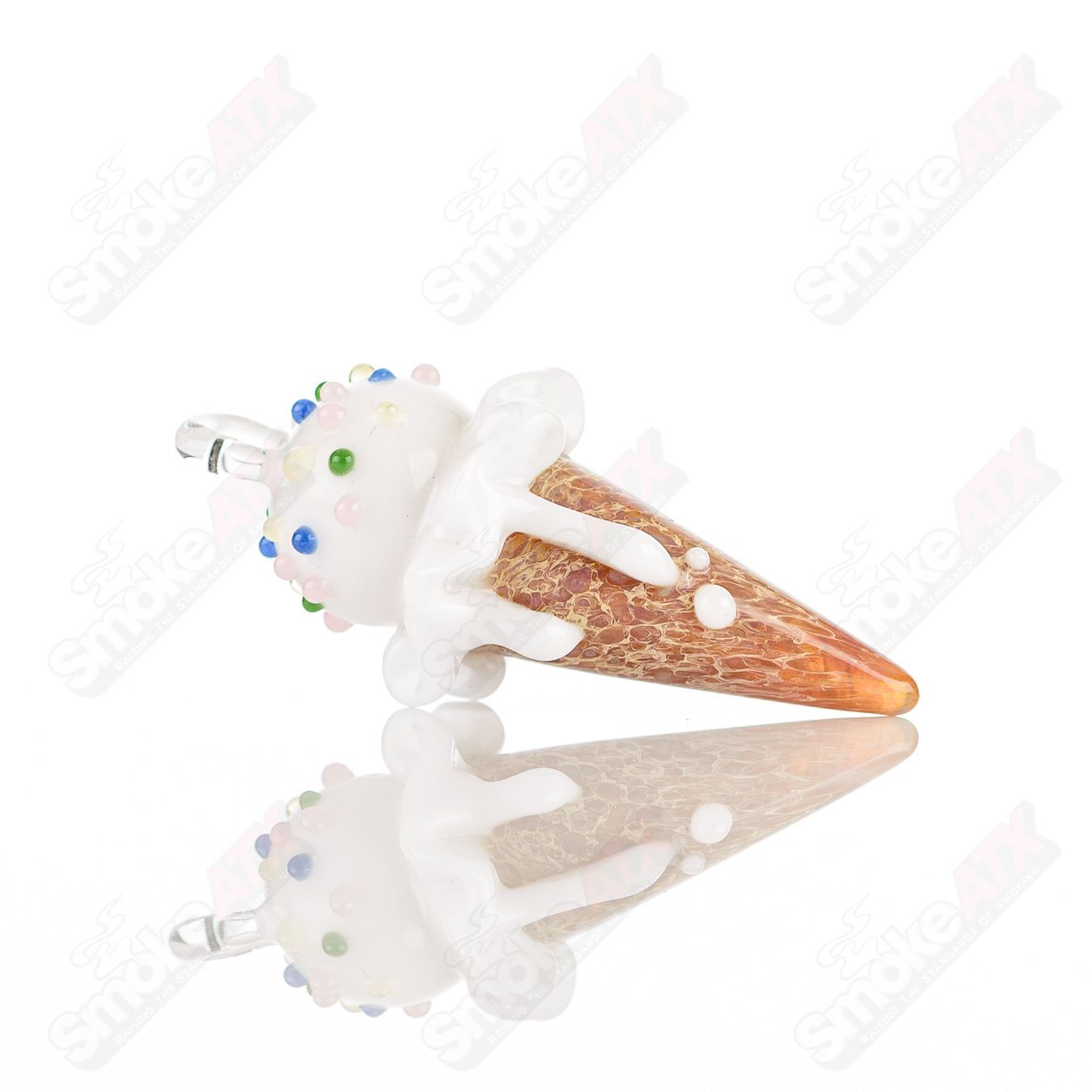 Mini cone pendant by Sweet Shop Glass featuring colorful glass art, designed by Renee Patula, on a transparent glass pendant.