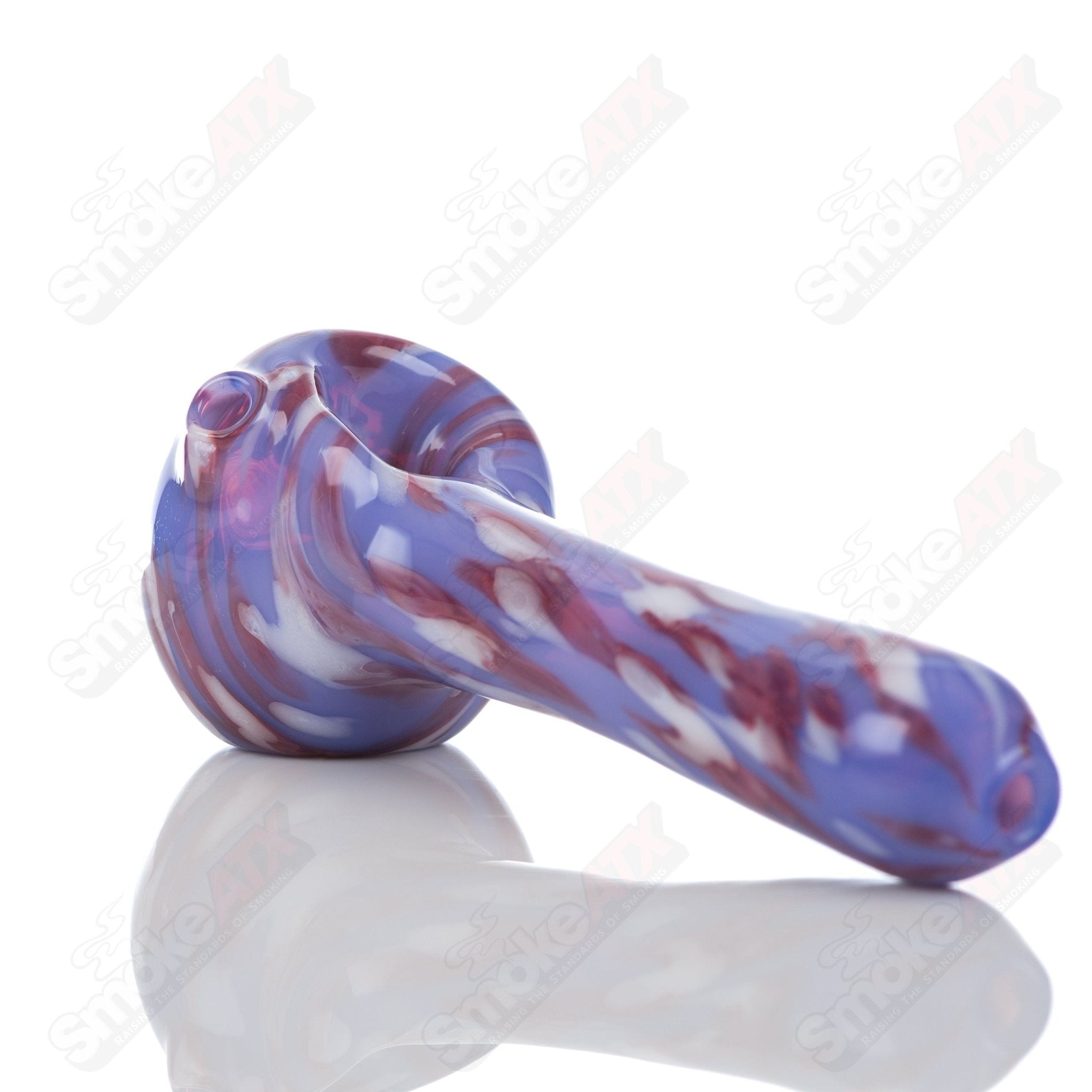 Purple splatter glass spoon pipe by Adventures In Glass Blowing, featuring a colorful, artistic design for smoking accessories.
