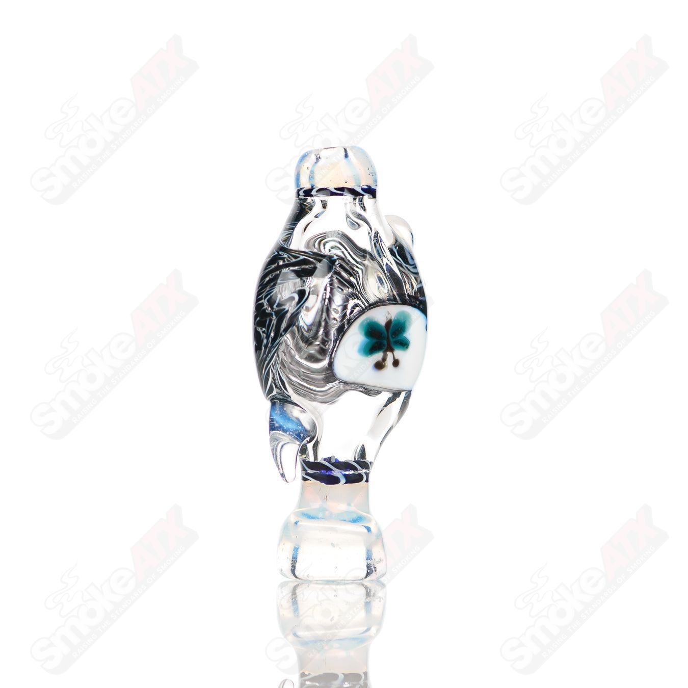 Small glass Chillum by Baby Dabs, designed for baby dabs, featuring a compact, clear glass construction with a simple pipe shape.