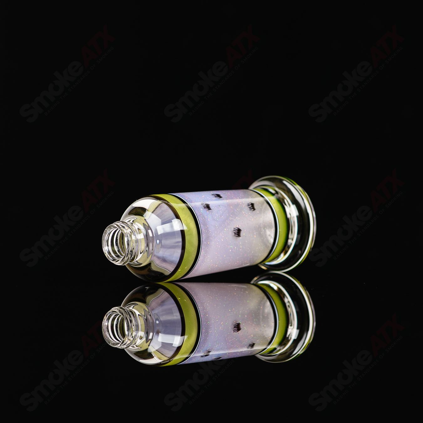 Micro Glass Heady Glass spray bottle with SPG x Micro branding, clear glass design, and spray nozzle for easy use.