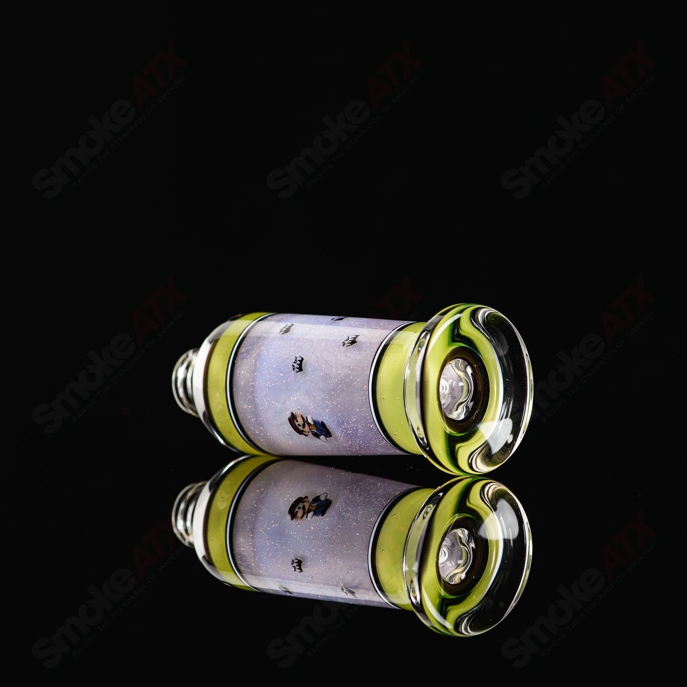 Clear glass spray bottle from Micro Glass with a black spray nozzle, designed for precise liquid application.