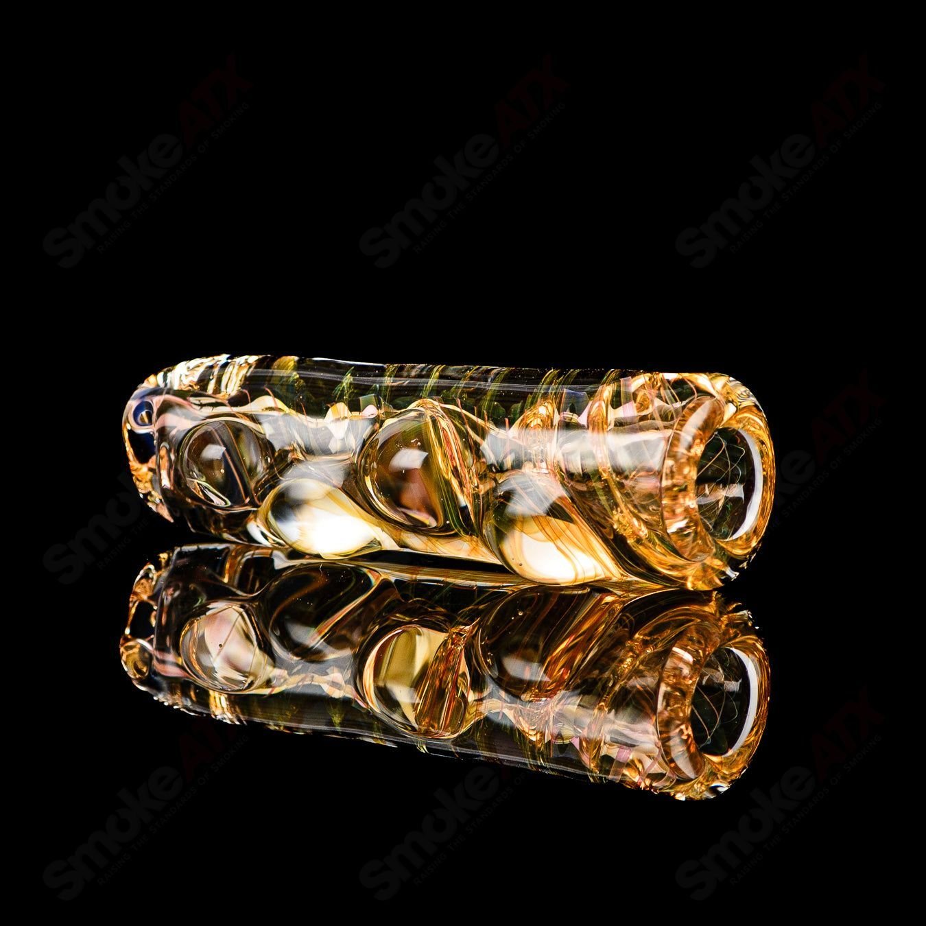 Clear Texas Hot Glass chillum pipe with a smooth, rounded shape and detailed glasswork, designed for discreet smoking sessions.