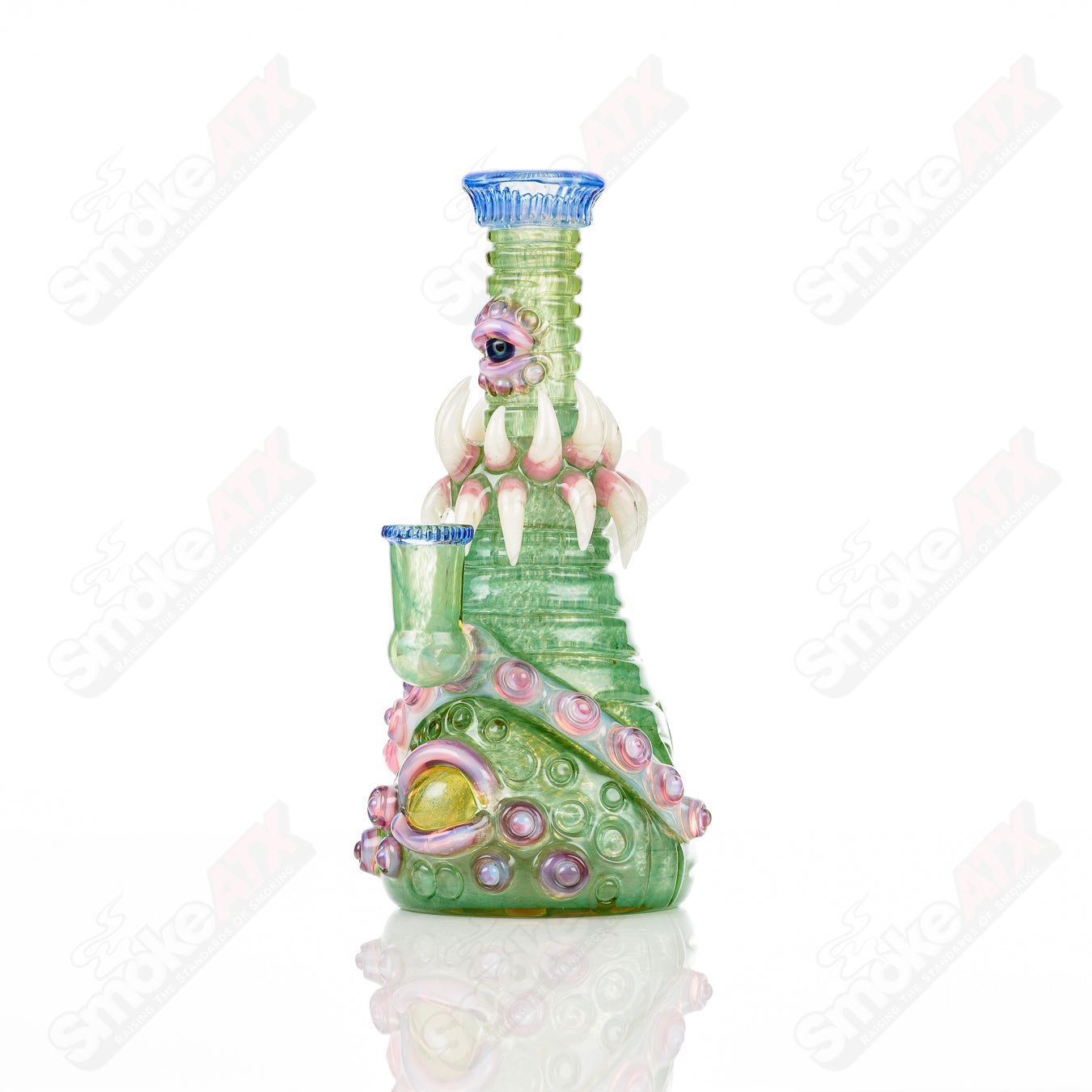UV double barrelled Rip Curl concentrate rig by Salt Glass, featuring vibrant UV-reactive glass and intricate heady design.