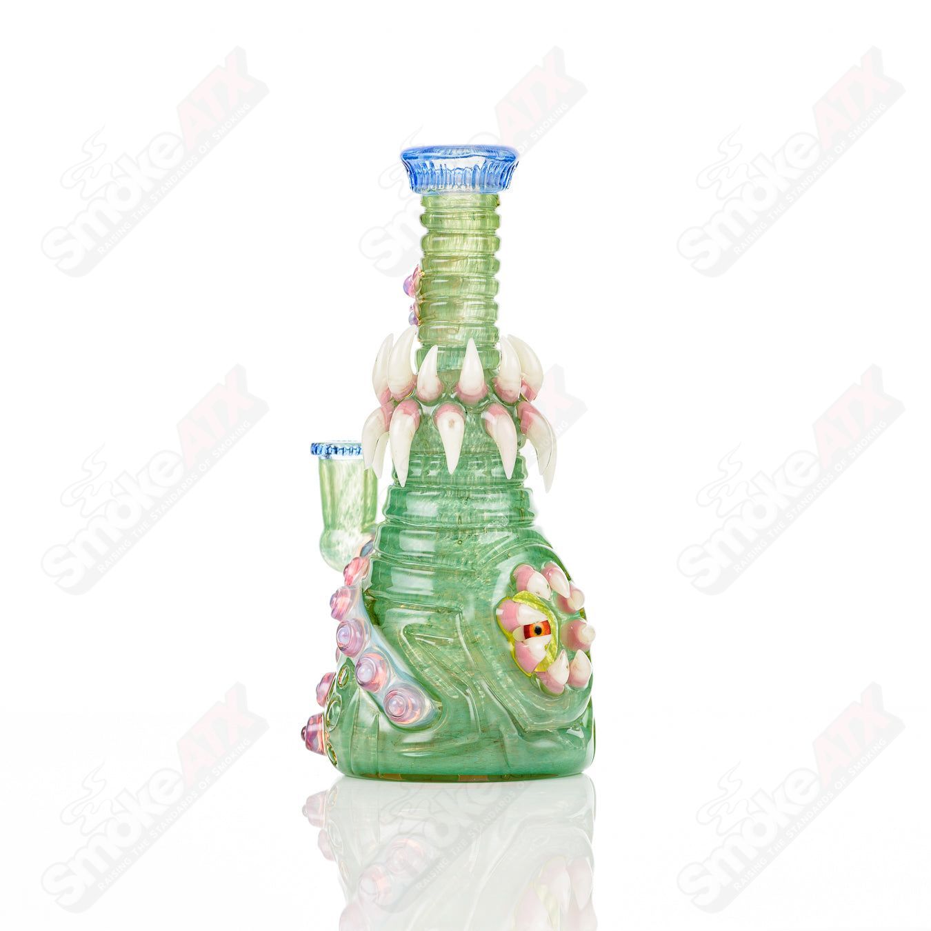 UV Double Barrelled Rip Curl heady glass concentrate rig by Salt Glass, featuring vibrant UV-reactive glass and intricate design details.
