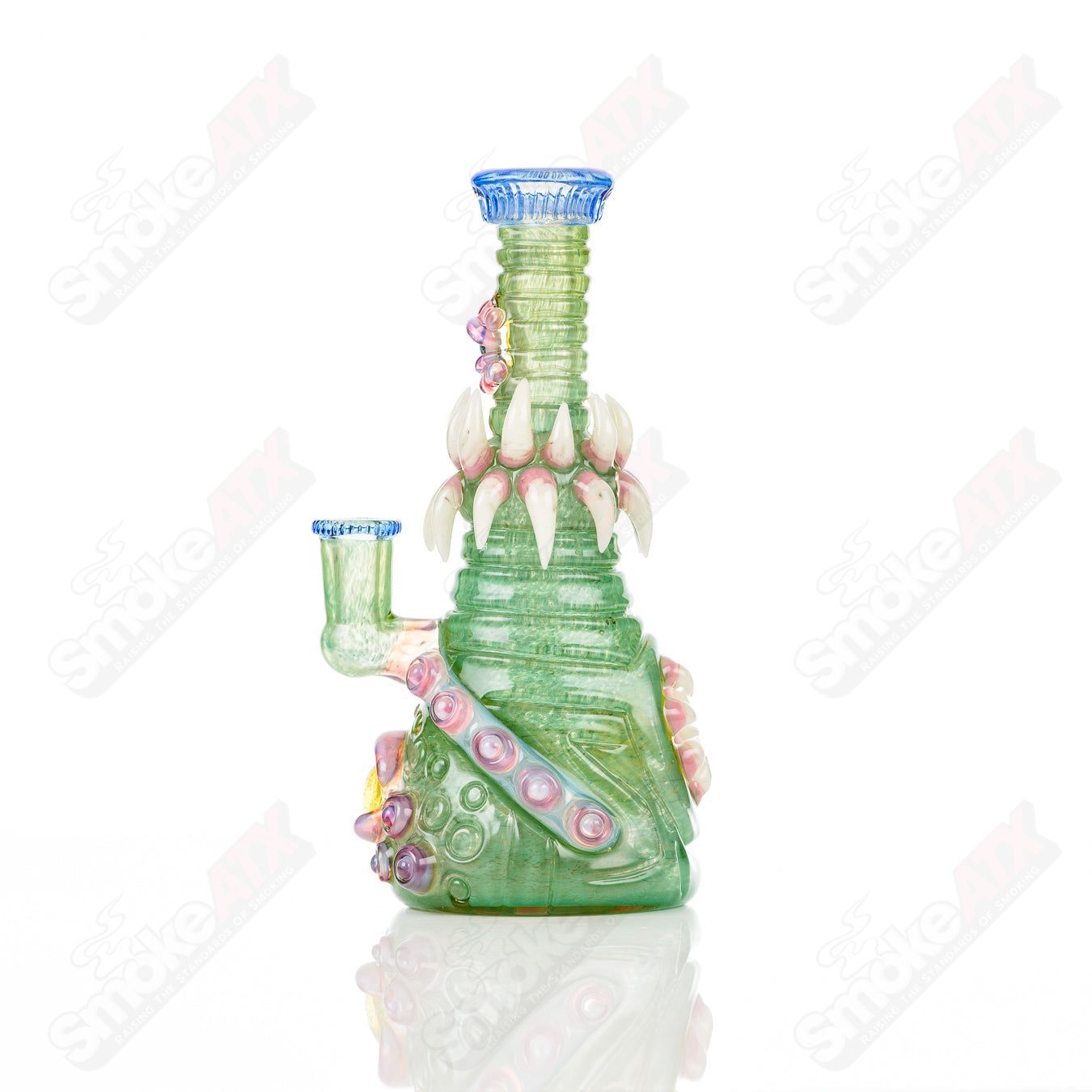 UV double barrel concentrate rig by Salt Glass, Rip Curl design, featuring vibrant UV-reactive glass and intricate heady glass details.
