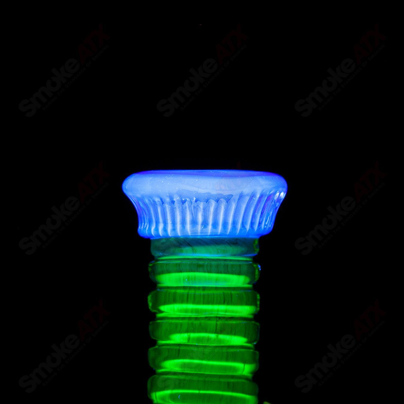 UV double barrelled concentrate rig by Salt Glass, featuring vibrant Rip Curl branding and colorful heady glass design.