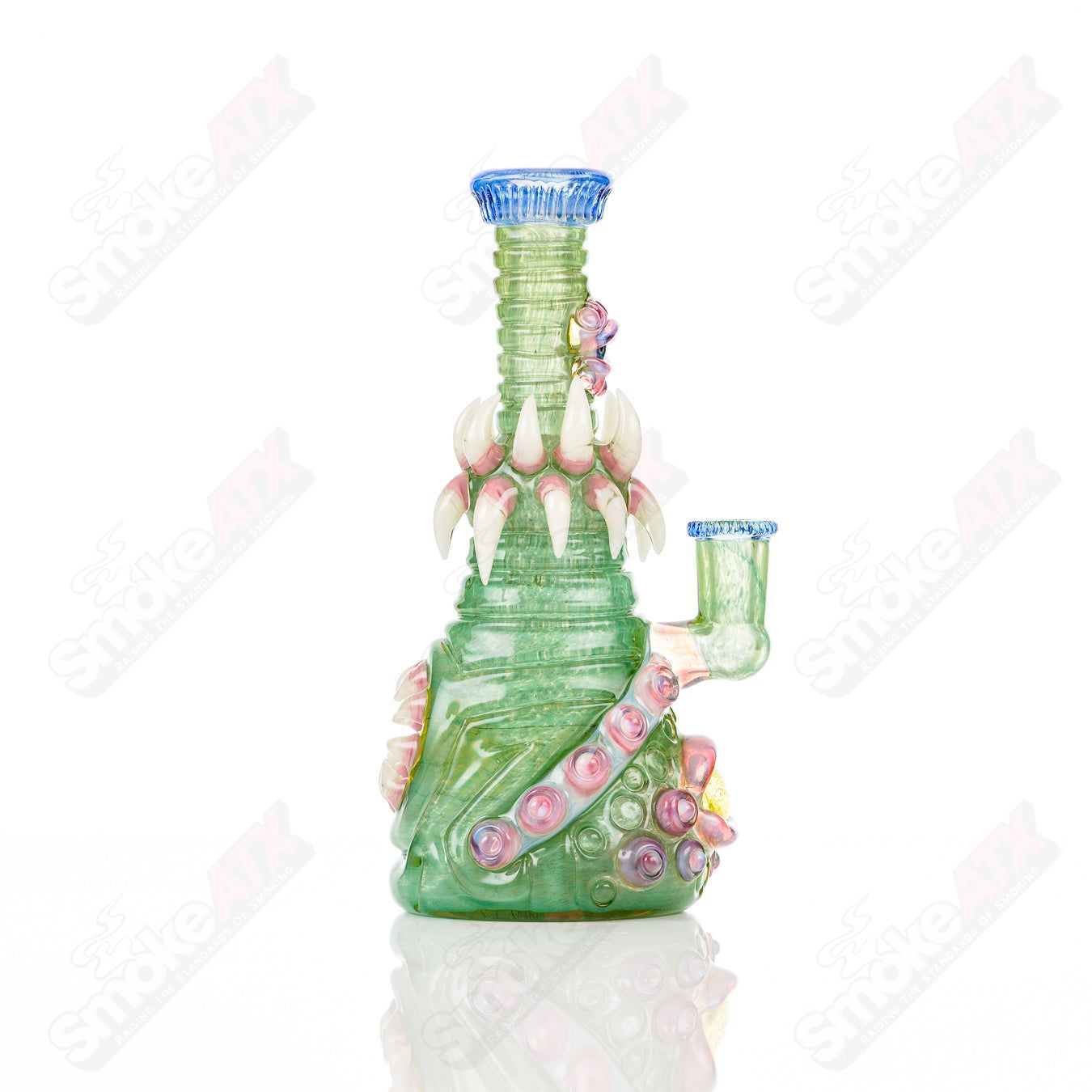 UV Double Barrelled Rip Curl concentrate rig by Salt Glass, featuring vibrant UV-reactive glass and intricate heady glass design.