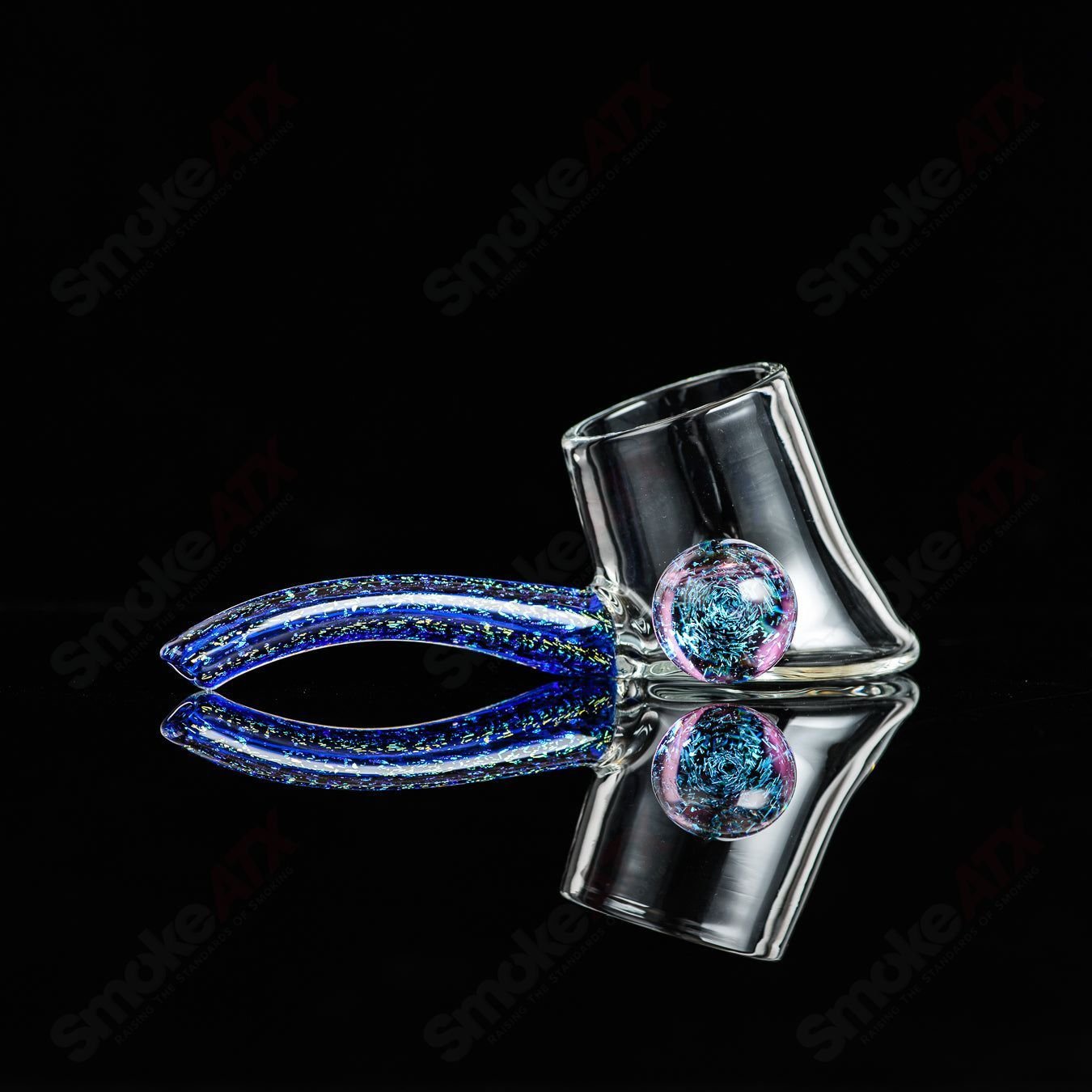 Justin Freeman #10 Dichro Proxy Attachment made of glass, a colorful and reflective accessory for glass jewelry or art projects.