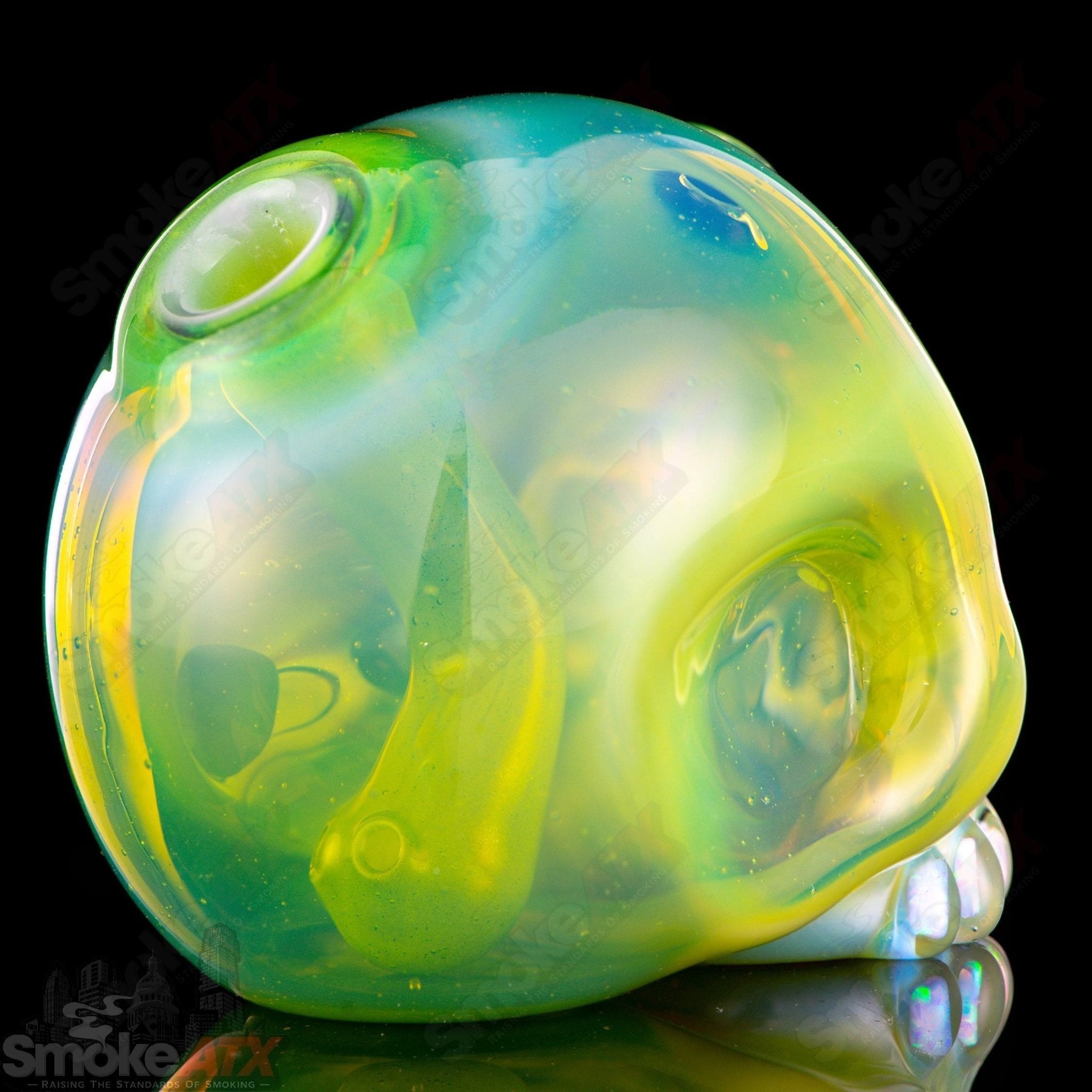 Carsten Carlile 10mm Guava Roots Skull Shredder heady glass concentrate rig with detailed skull design and vibrant colors.