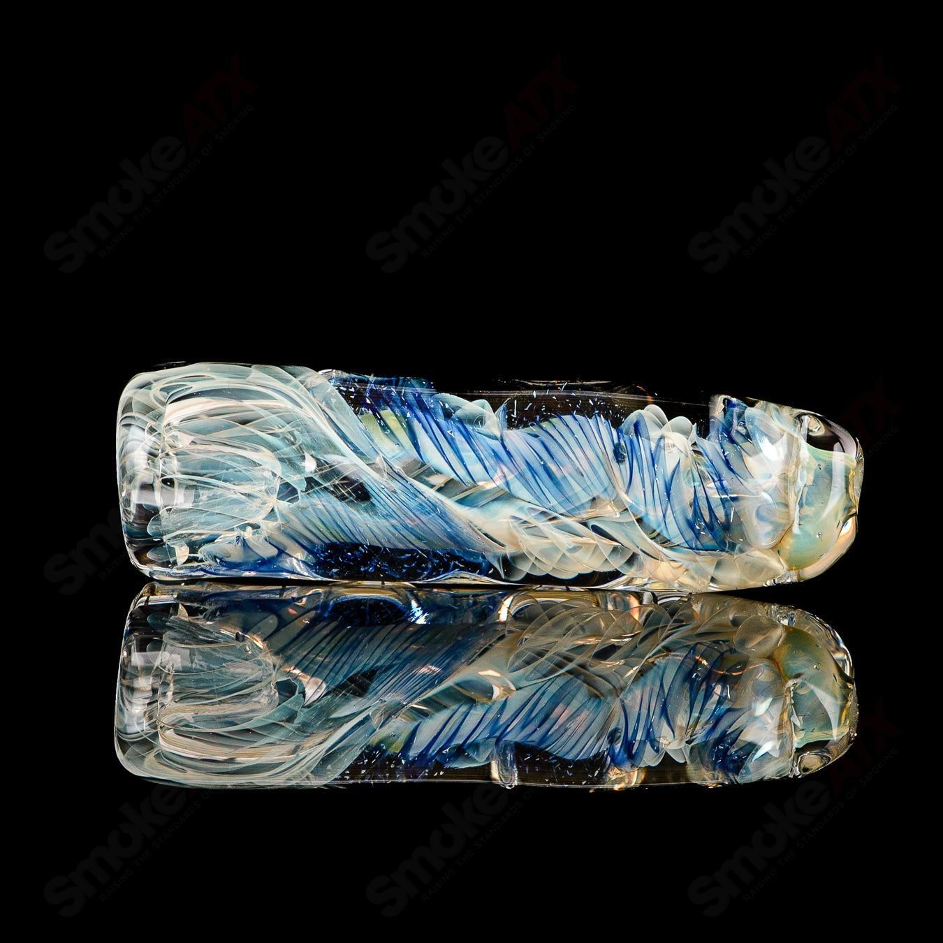 Texas Hot Glass 15 Taster Chillum glass pipe with detailed design, used for smoking, showcasing clear glass craftsmanship.