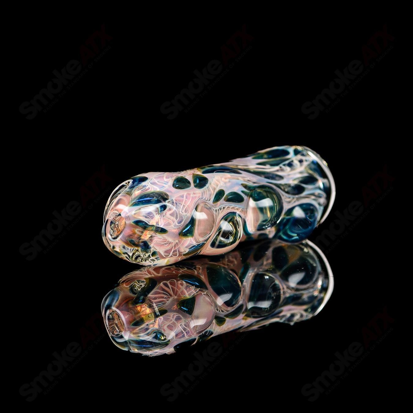 Texas Hot Glass 16 Taster Texas Hot Glass chillum glass pipe showing a clear, compact design for smoking enjoyment.