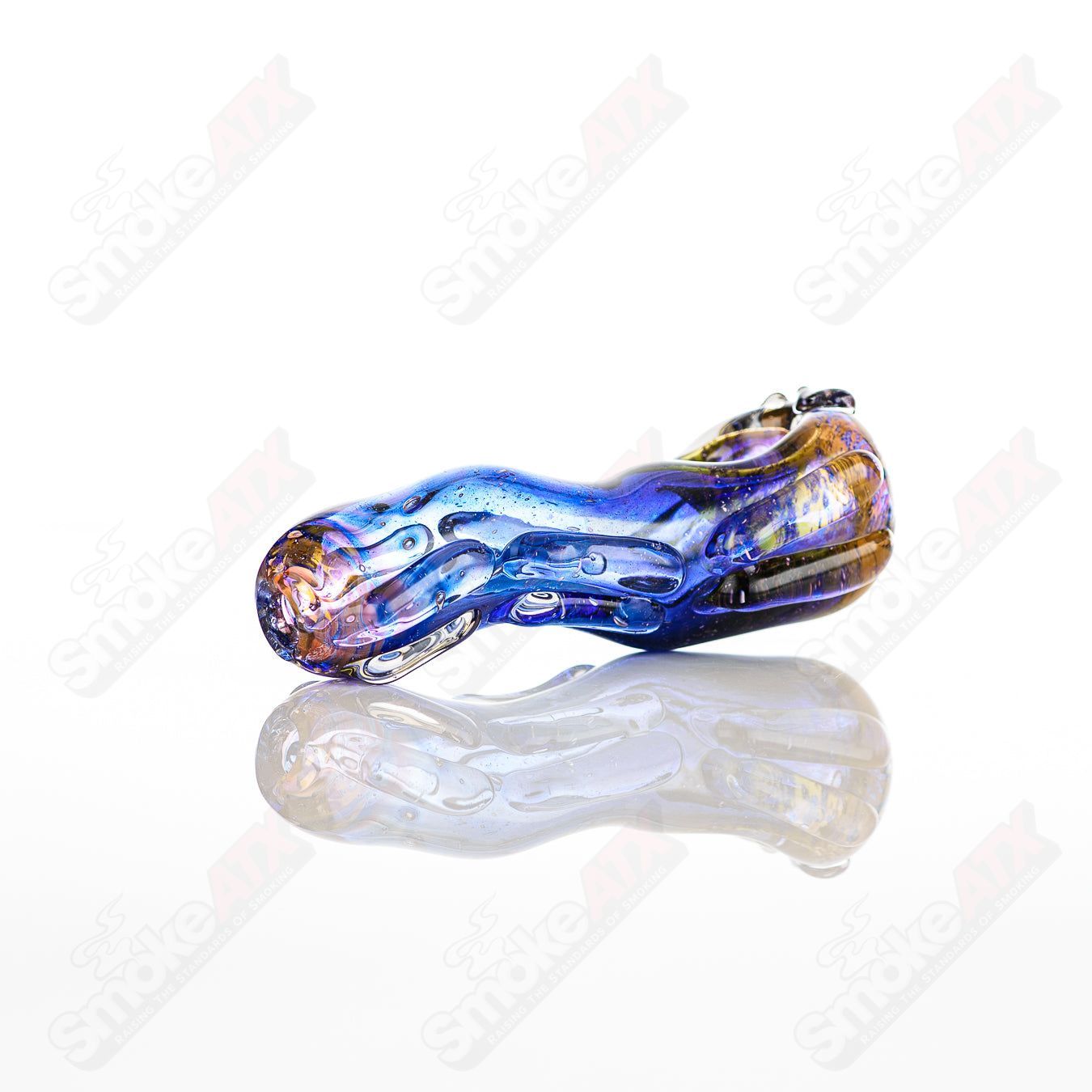 Clear glass spoon pipe by Nobody featuring a smooth, rounded bowl and a long, slender stem for easy handling.