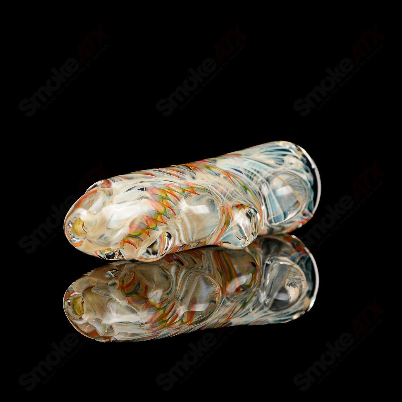 Clear Texas Hot Glass Taster Chillum with smooth, rounded shape and branded logo, designed for discreet smoking experiences.