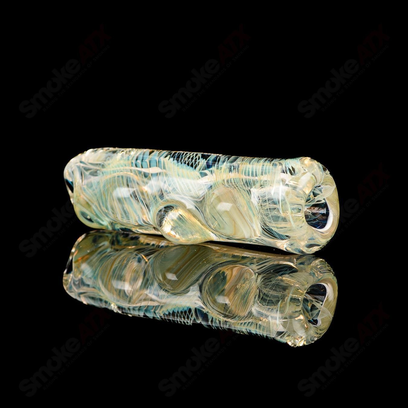 Texas Hot Glass Taster #19 Chillum glass with a clear design and compact shape for easy handling and smoking.