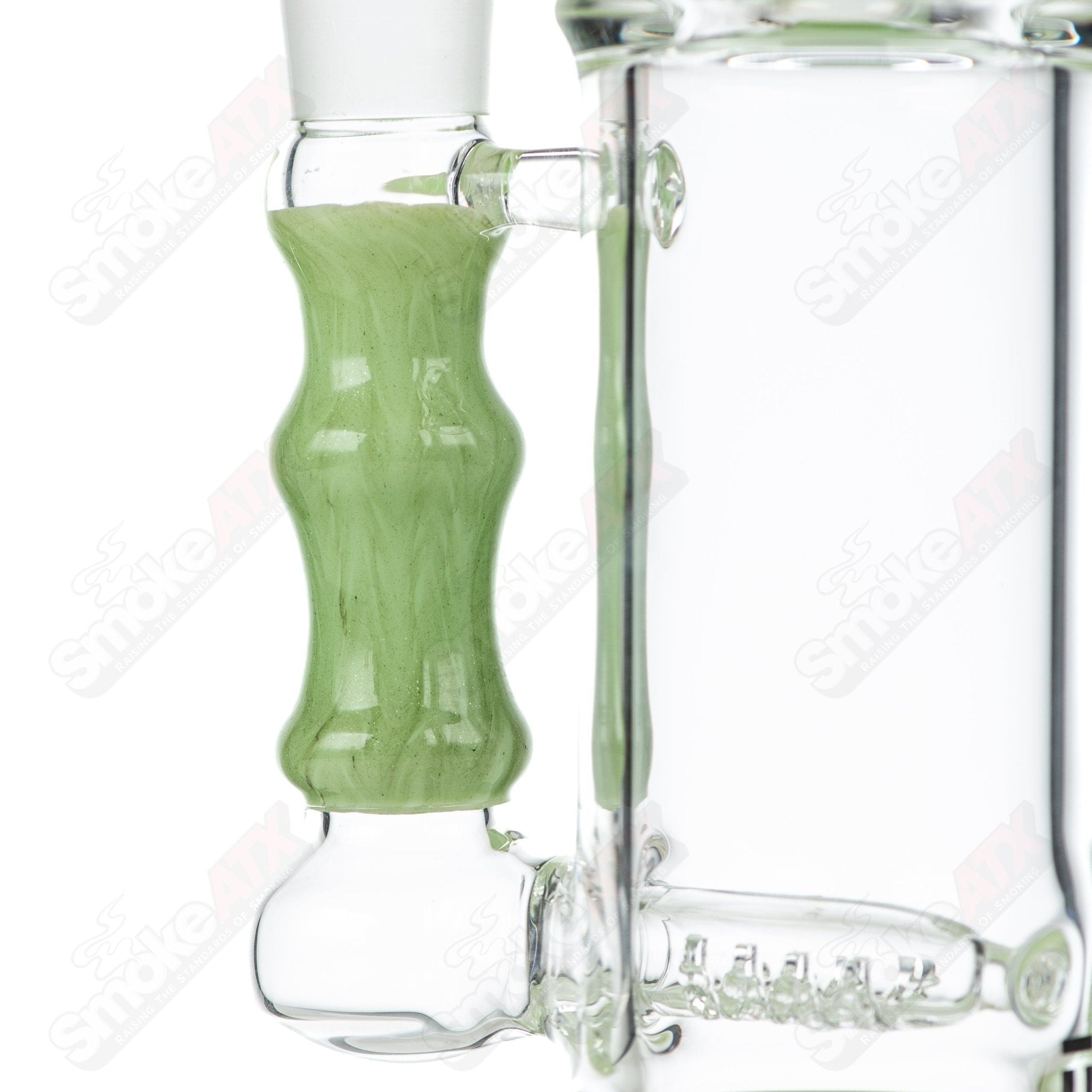 Tagle Glass inline tube bubbler with 18mm and 50mm wrap and rake design, made from clear glass, showcasing intricate craftsmanship.