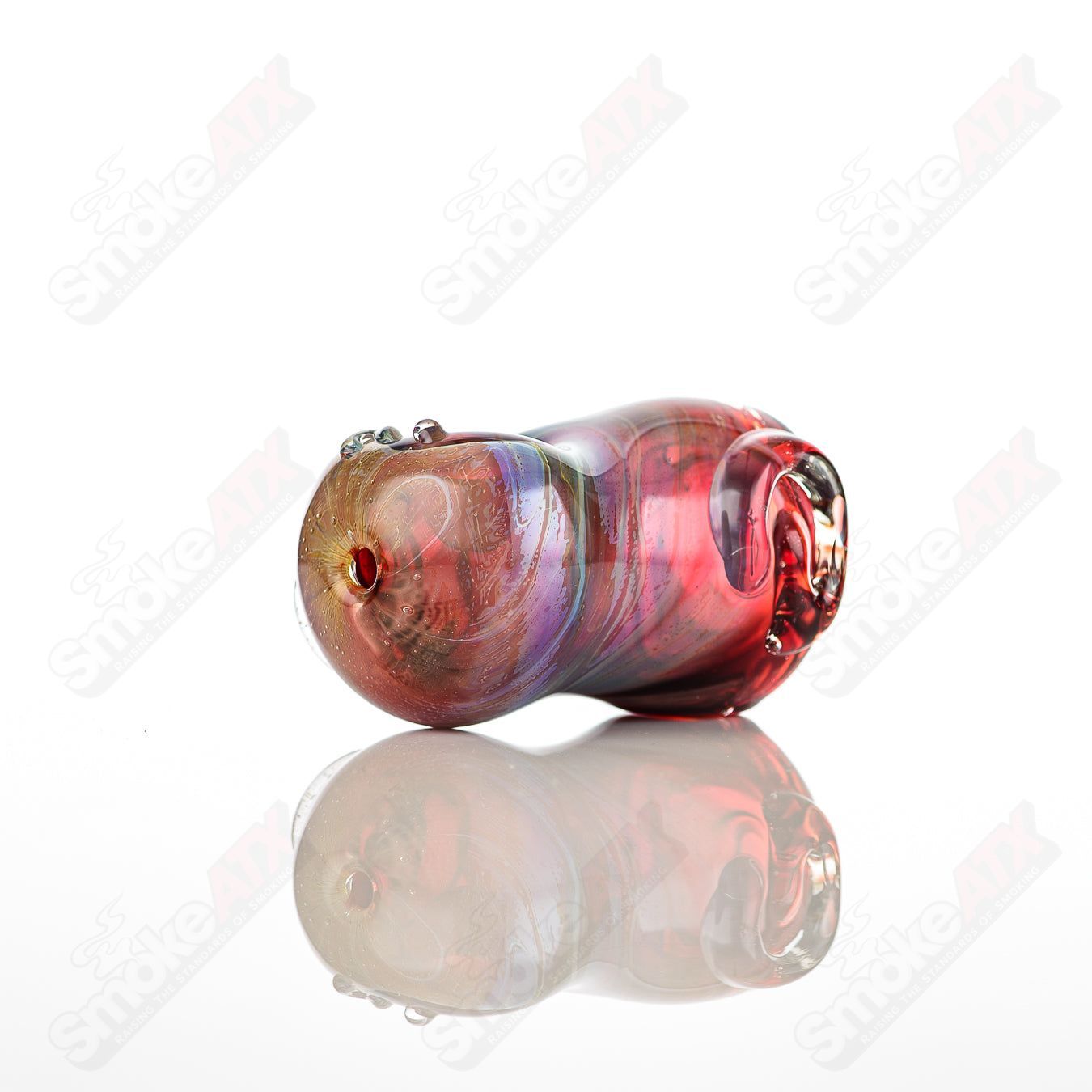 Glass pipe by Nobody featuring a unique bean-shaped spoon design, made of clear glass with intricate details.