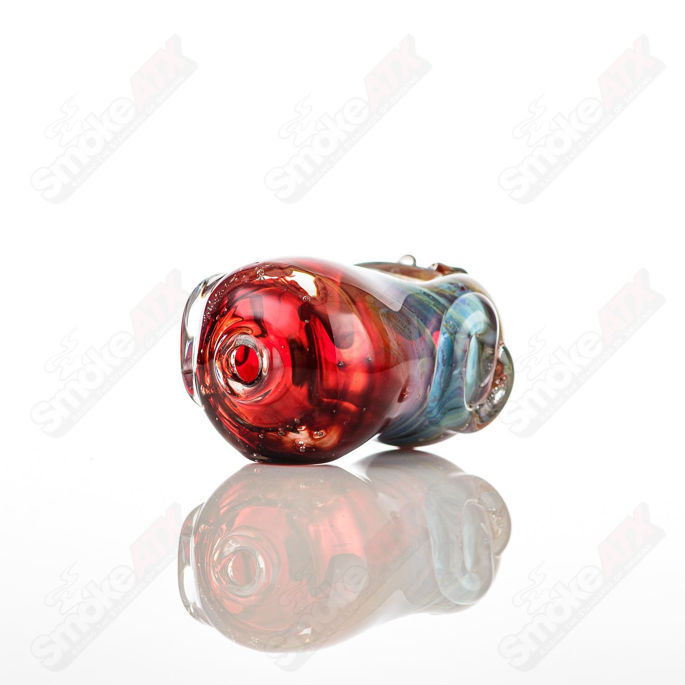 Clear glass bean-shaped spoon pipe by Nobody, featuring a smooth, rounded design for easy handling and use.