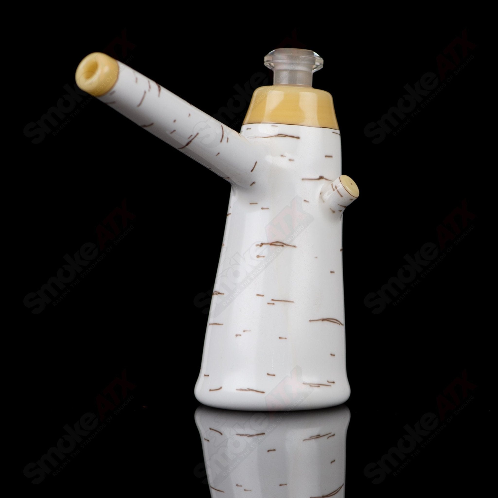 Foster Glass Birch Poker Rig, a heady glass concentrate rig with intricate design and clear glass construction.