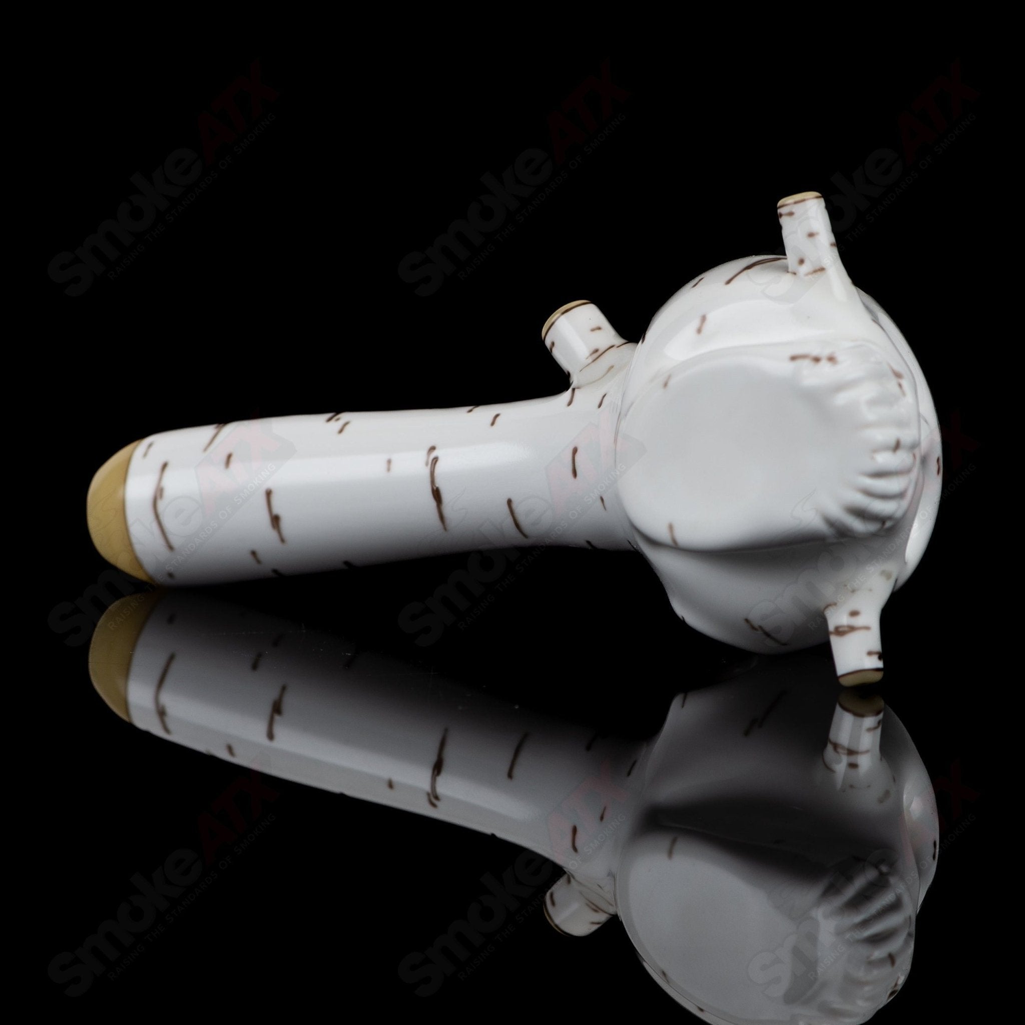 Foster Glass Heady Glass Birch Skull Spoon hand pipe featuring a detailed skull design and clear glass construction.
