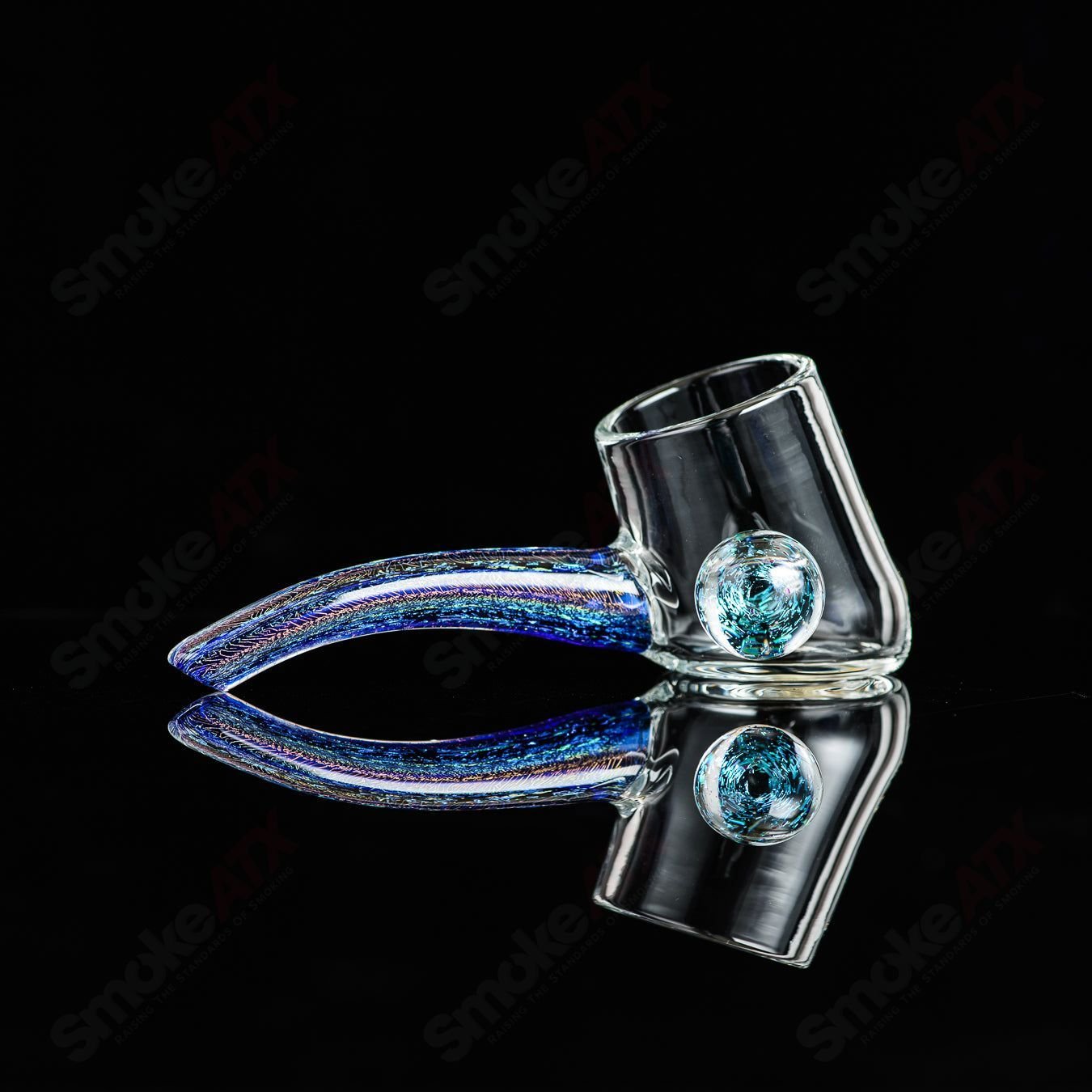 Justin Freeman Dichro Proxy Attachment made of glass, showcasing vibrant dichroic colors and intricate design details.