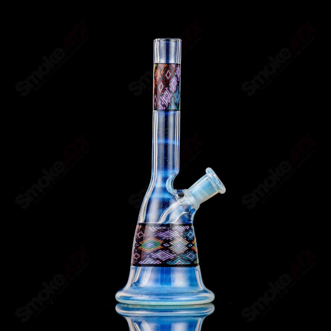 John W Glass Filla Tube, clear heady glass concentrate rig with intricate design and sturdy base, designed for dabbing and concentrates.