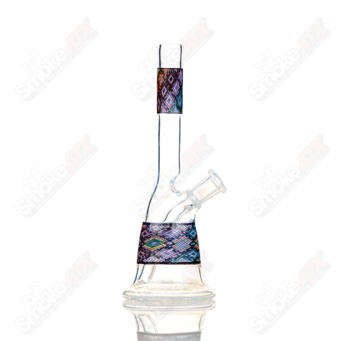 John W Glass Filla Tube, a clear heady glass concentrate rig with a sleek tube design and intricate glasswork.