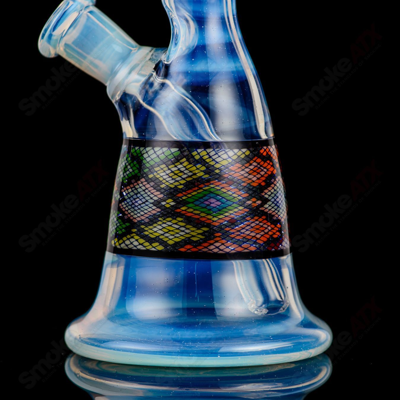 John W Glass Filla Tube, a clear heady glass concentrate rig with intricate design and durable glass construction.