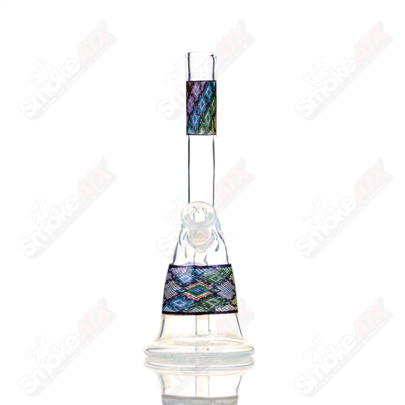 John W Glass Filla Tube, a clear heady glass concentrate rig with intricate design details for dabbing.
