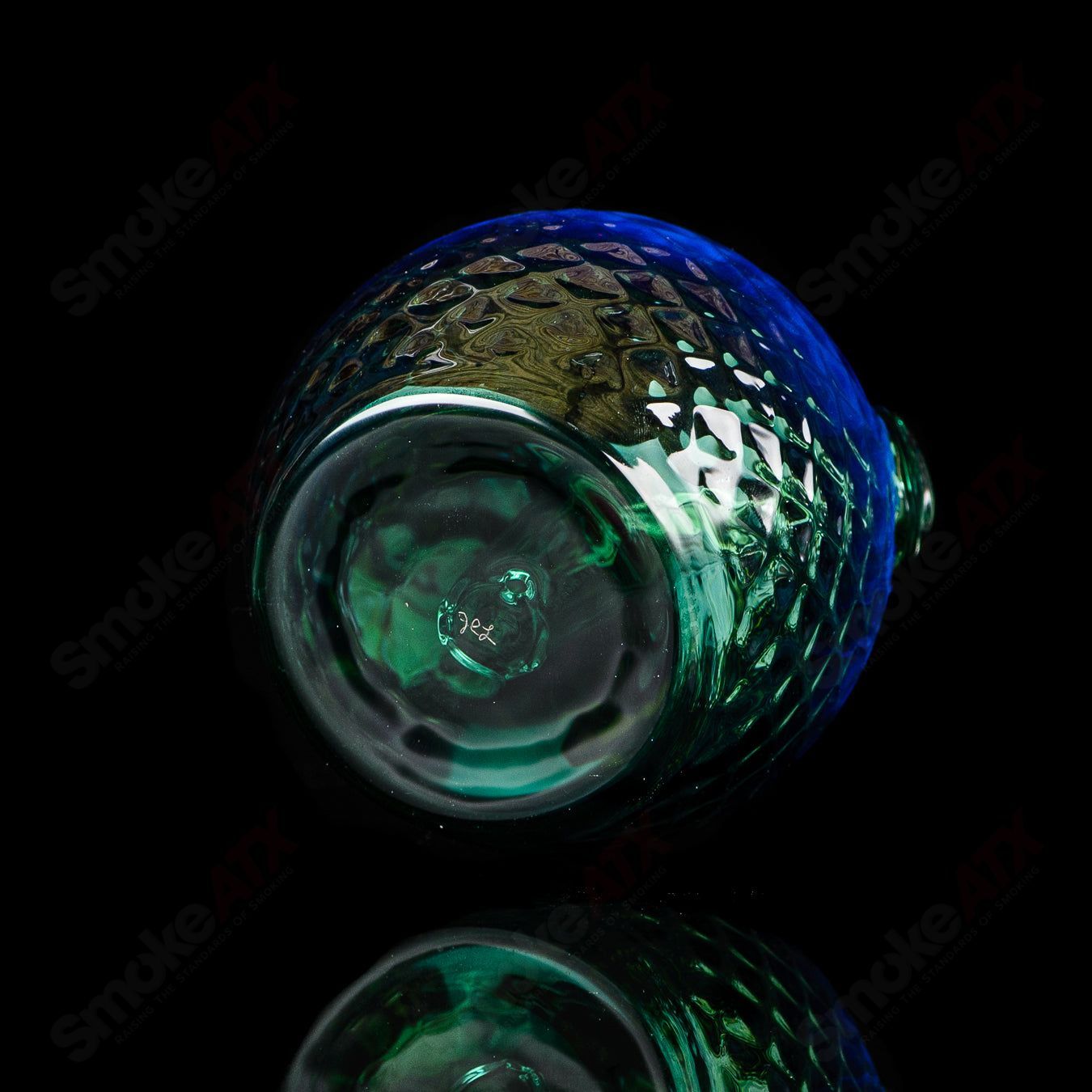 Fumed color sphere rig by James Lang, glass concentrate rig featuring a spherical design and vibrant, smoky glass finish.