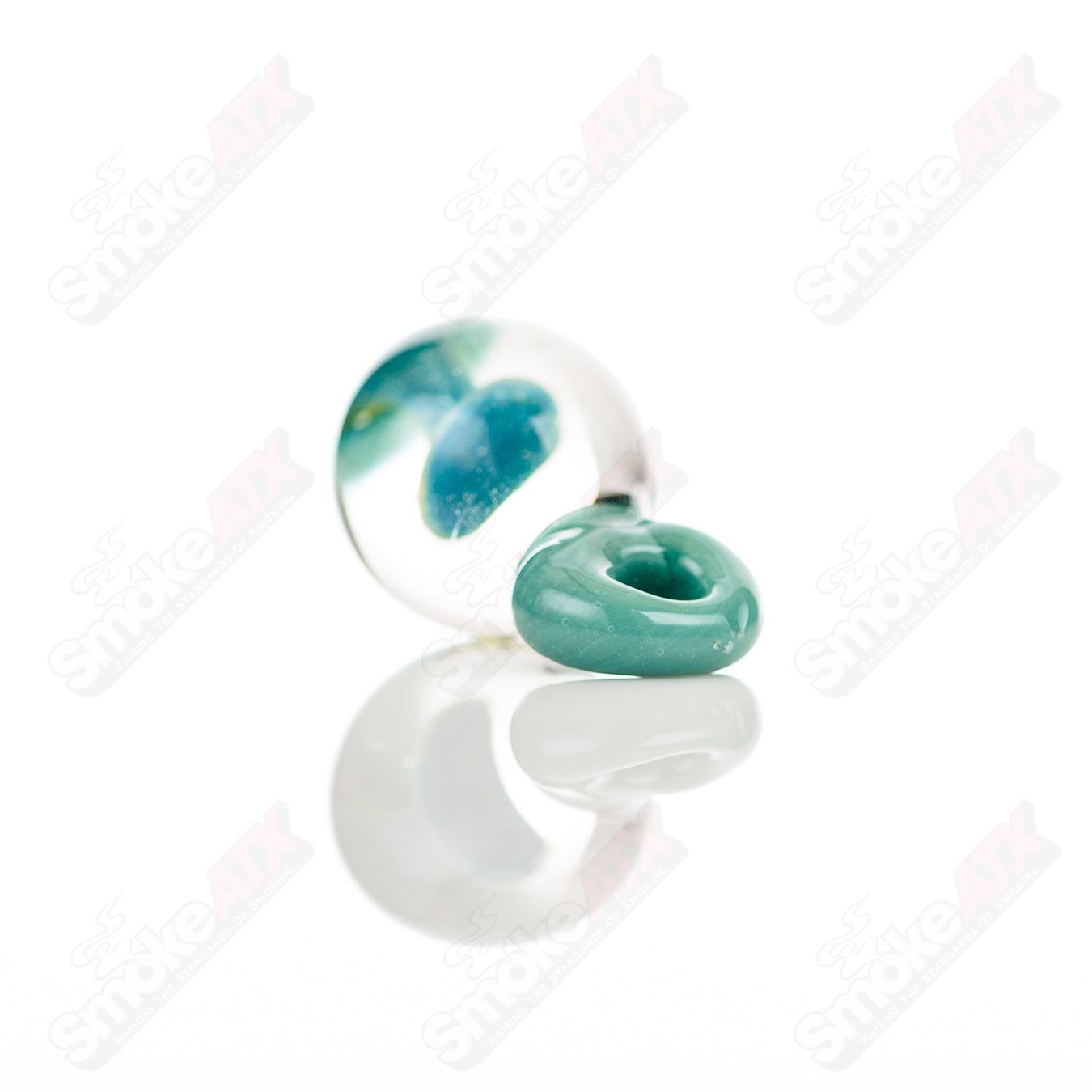 C4K Glass Implosion Pendant made of colorful C4K glass with intricate design, hanging on a silver chain.