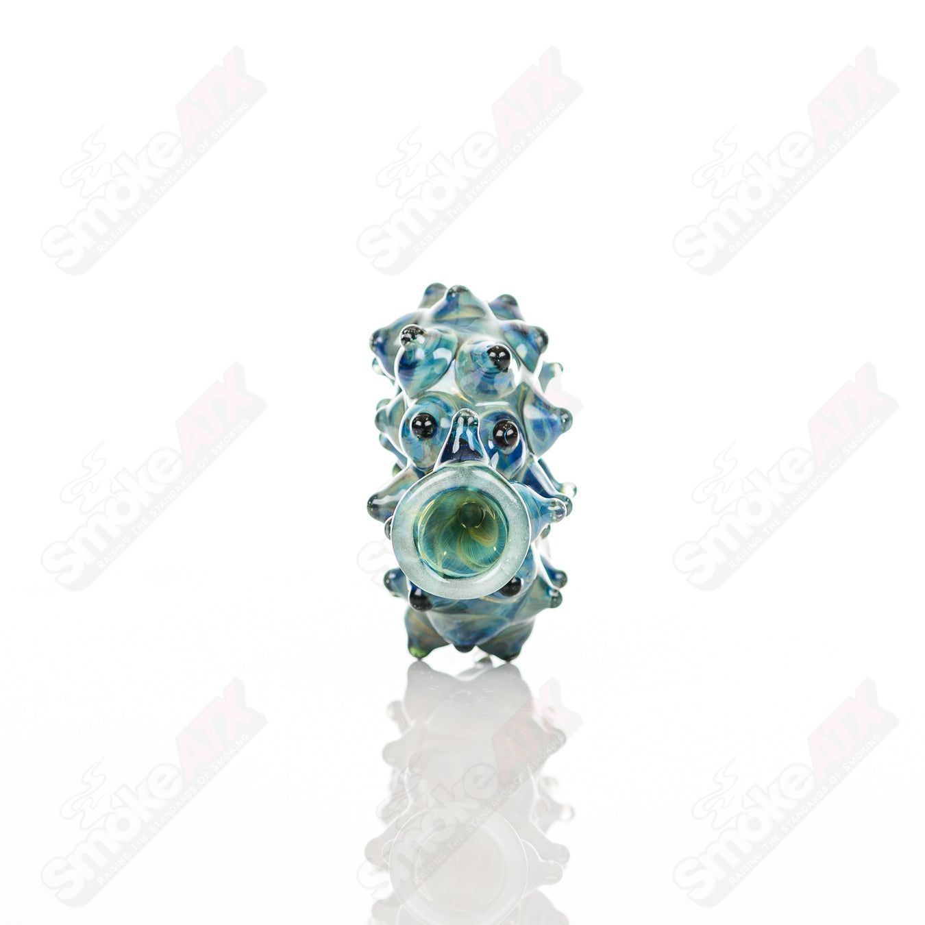 Large glass donut chillum by Baby Dabs, designed for baby dabs, featuring a colorful donut shape and clear glass construction.