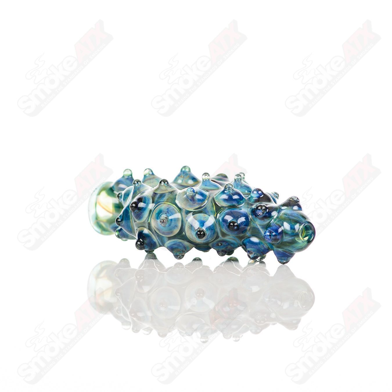 Large glass donut chillum by Baby Dabs, designed for baby dabs, featuring a colorful donut shape and clear glass construction.
