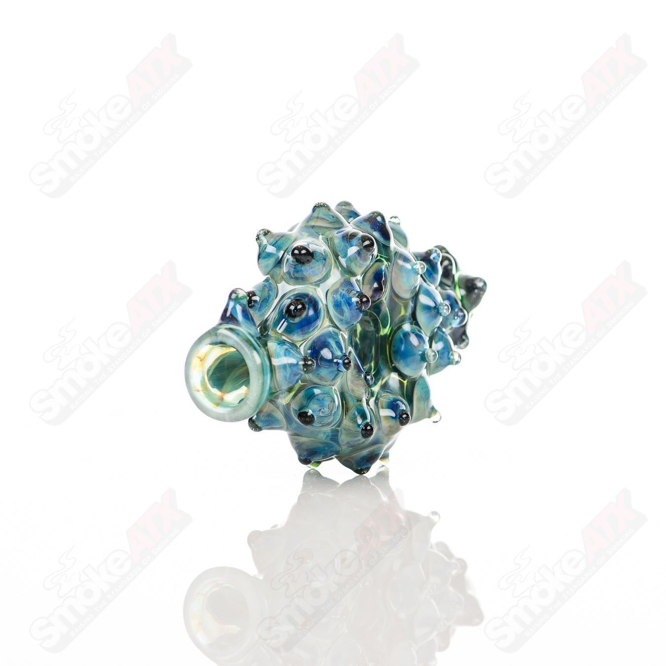 Large glass donut chillum by Baby Dabs, designed for baby dabs, with a colorful donut-shaped mouthpiece and clear glass body.