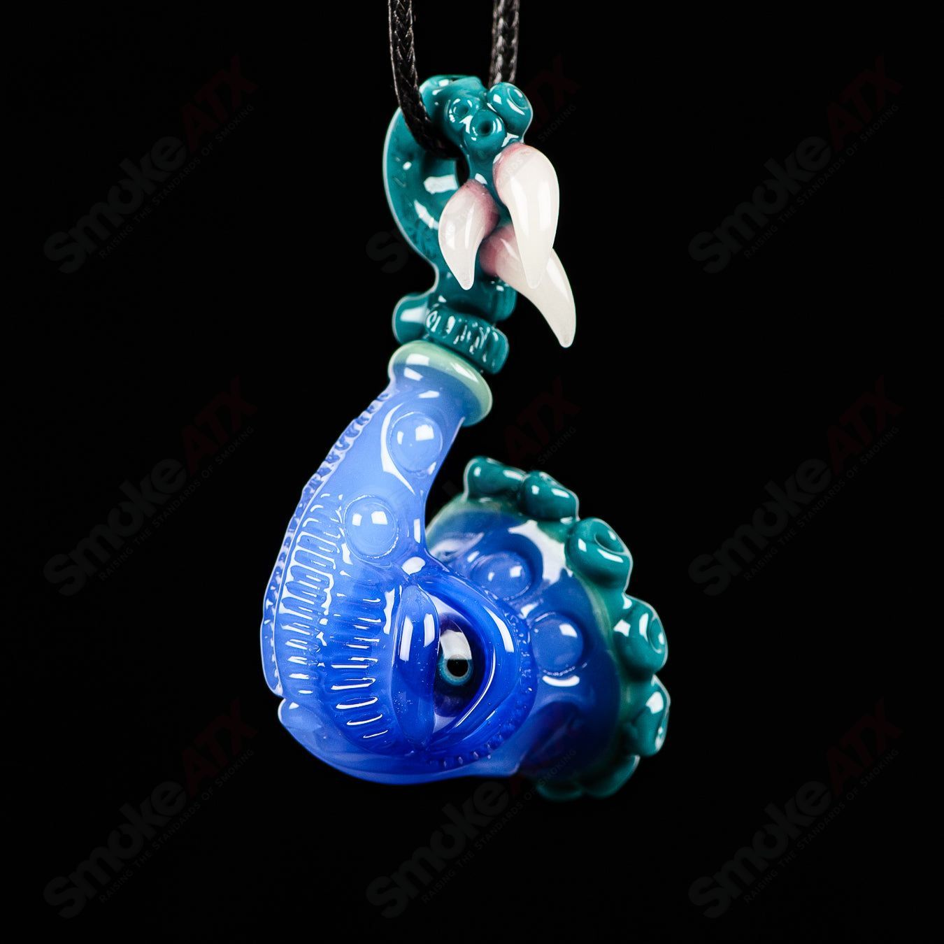 JMass Sherlock Pendant, a heady glass pendant featuring a detailed Sherlock Holmes-inspired design, hanging from a chain.