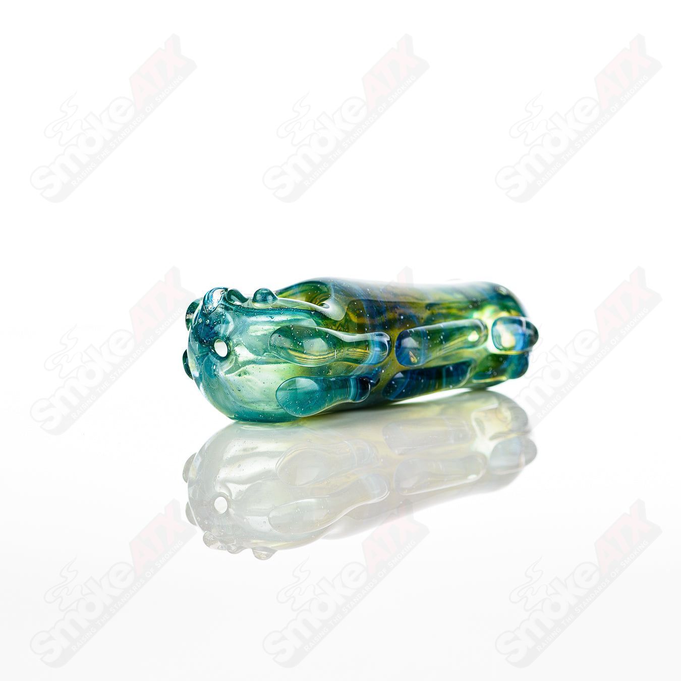 Glass pipe titled "Spoon Glass" by Nobody, featuring a clear glass design with a rounded bowl and smooth finish.