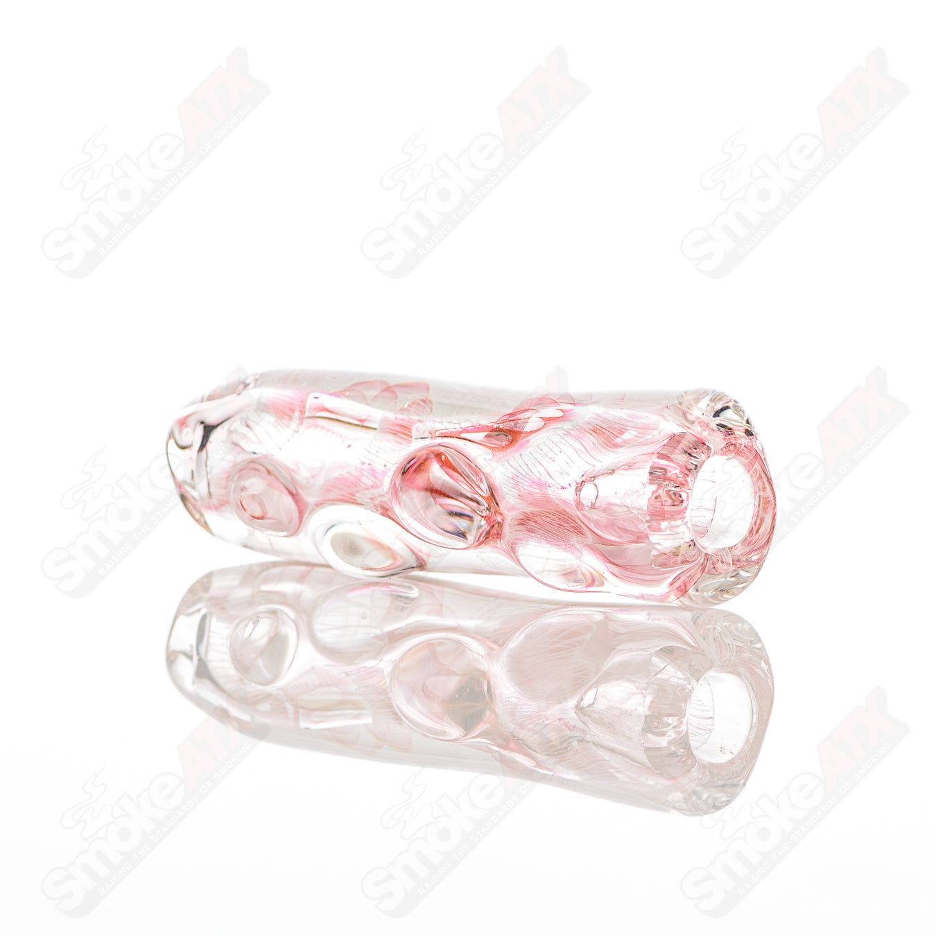 Texas Hot Glass Taster 21-chamber chillum glass for smoking, clear glass with intricate design and compact shape.