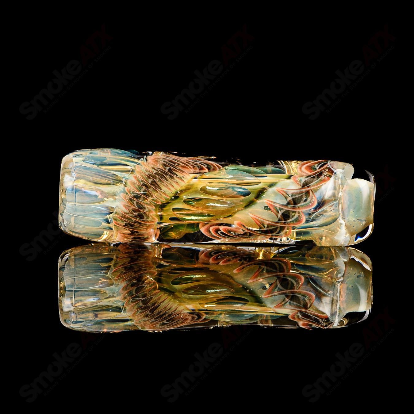 Texas Hot Glass Taster #23 Chillum glass pipe, clear glass with intricate design, used for smoking, compact and portable.