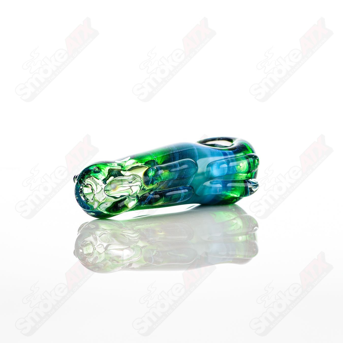 Clear glass spoon pipe by Nobody, featuring a smooth, rounded bowl and a long stem for easy handling and smoking.
