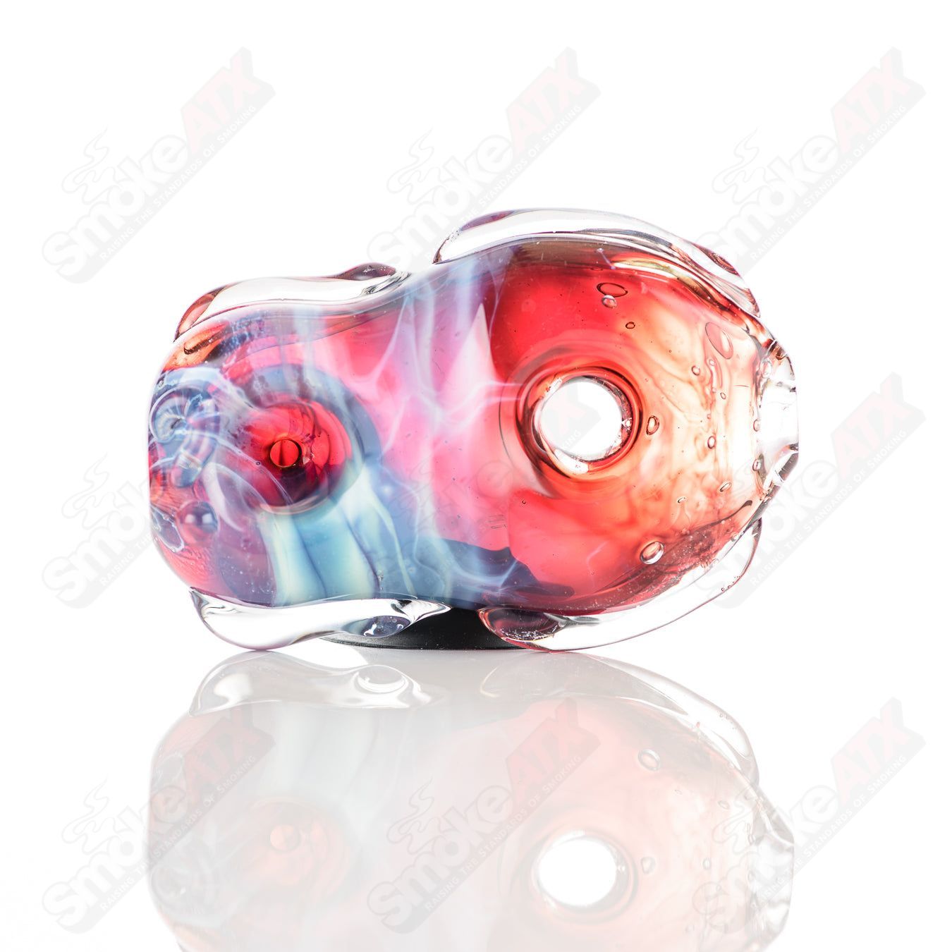 Glass pipe featuring a colorful donut chillum design by Nobody, made of clear glass with intricate details and a smooth shape.
