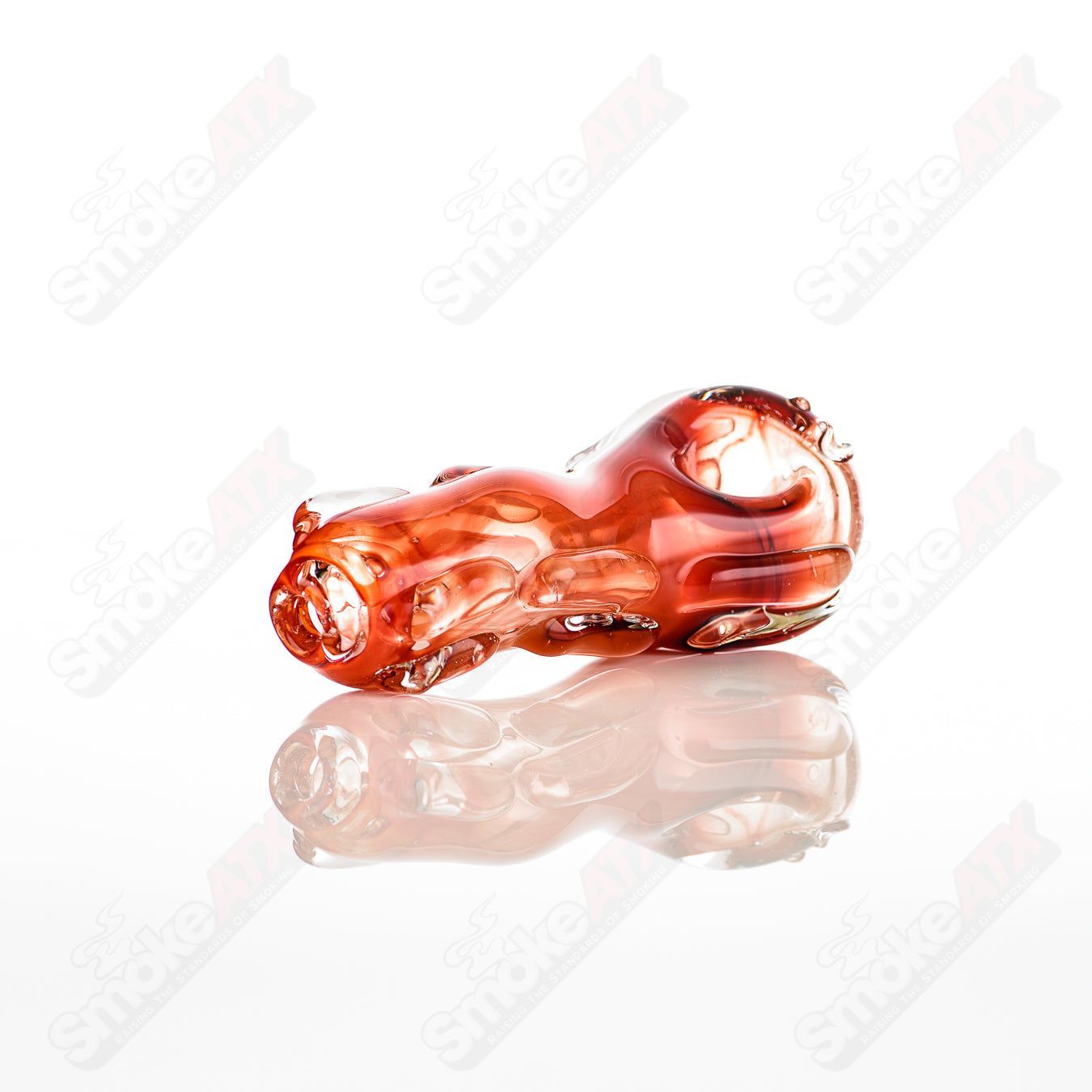 Glass pipe called the Spoon Glass by Nobody, featuring a clear, smooth, curved glass design for smoking.