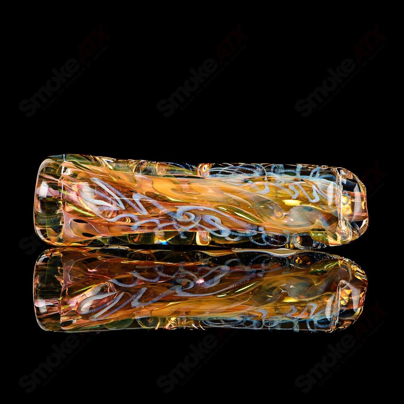 Texas Hot Glass Taster #28 Chillum glass pipe with clear glass construction and intricate design details.