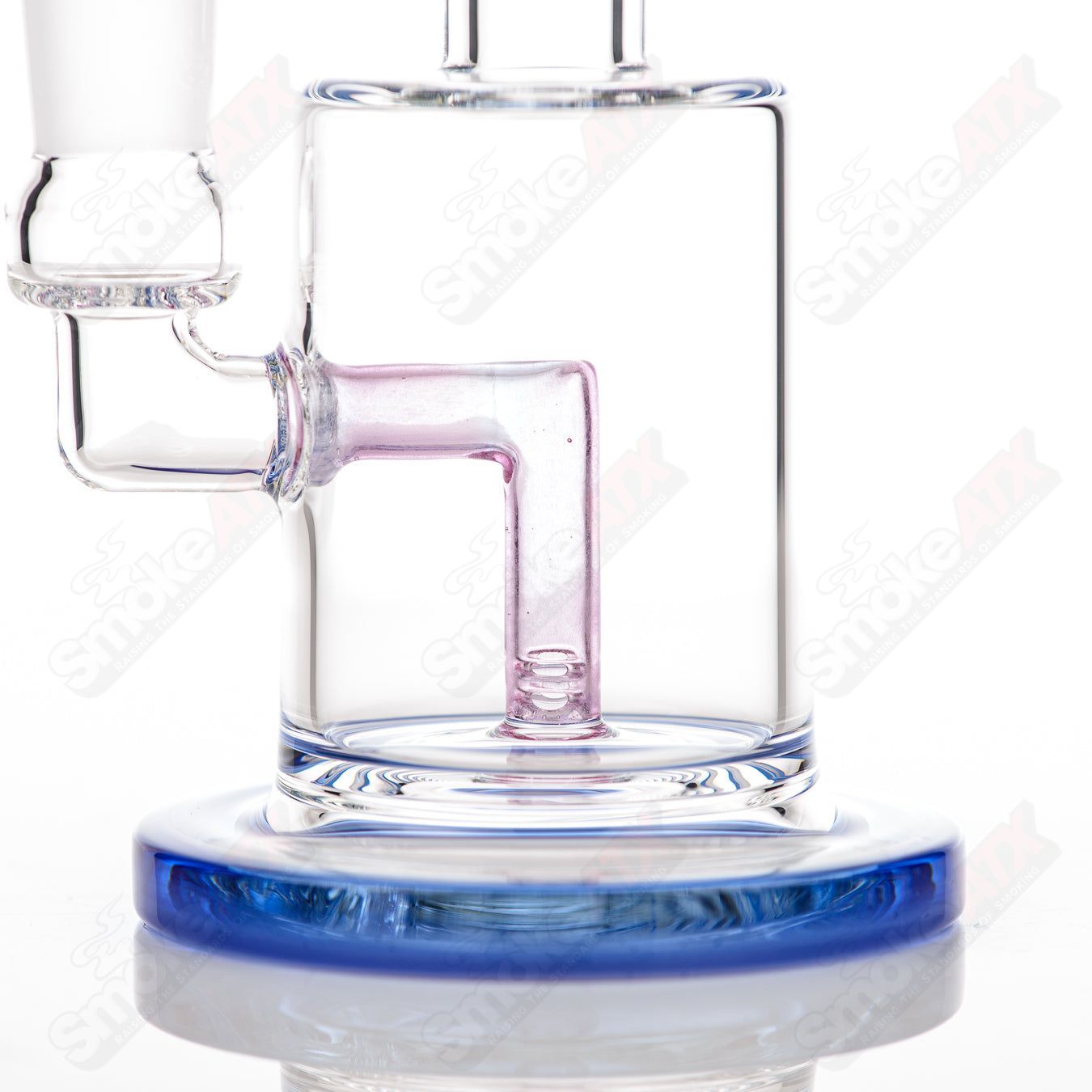 Toro 14mm Macro XL concentrate rig with dual-color foot and mouthpiece, made of clear glass with intricate design details.