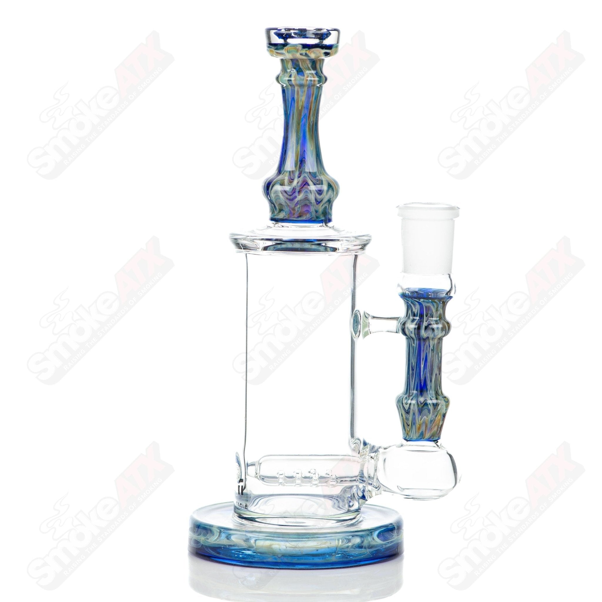 Tagle Glass inline tube bubbler with 18mm and 50mm wrap and rake design, clear glass construction with intricate details.