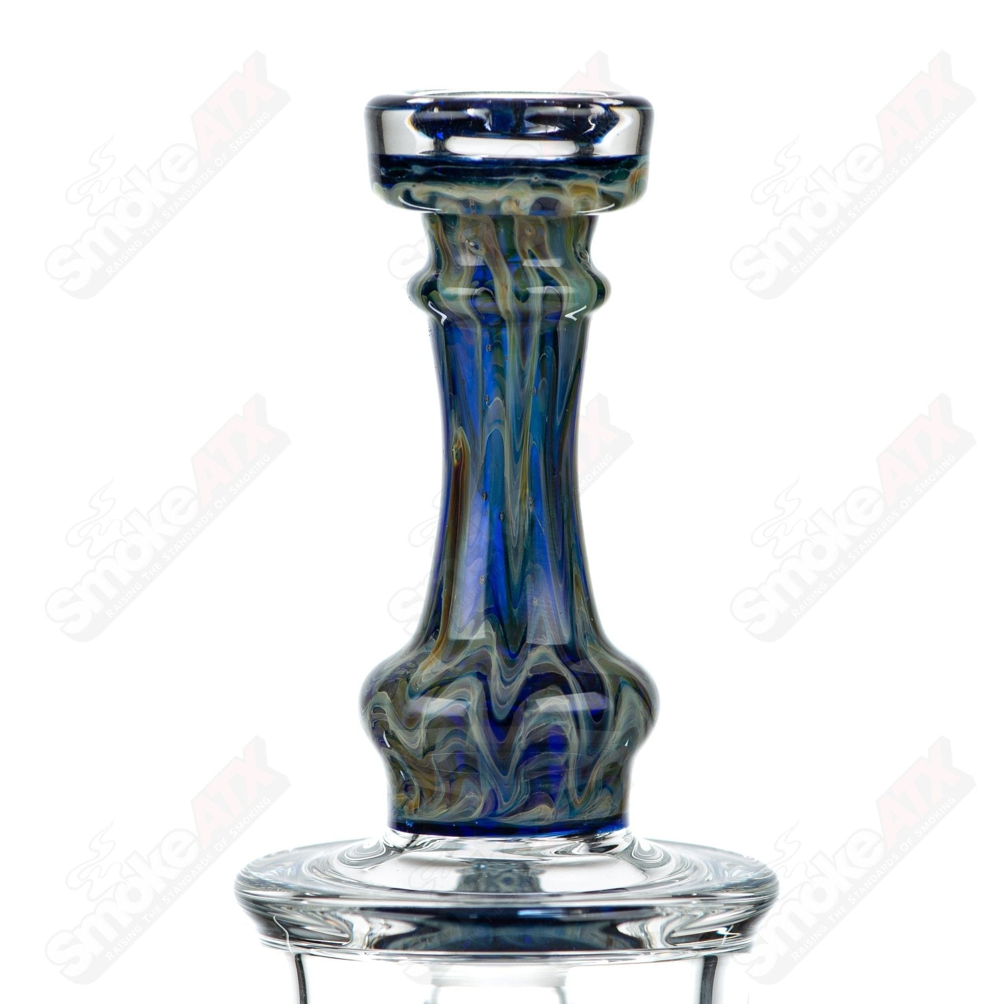 Tagle Glass inline tube bubbler with 18mm and 50mm wrap and rake design, made of clear glass, showcasing intricate craftsmanship.