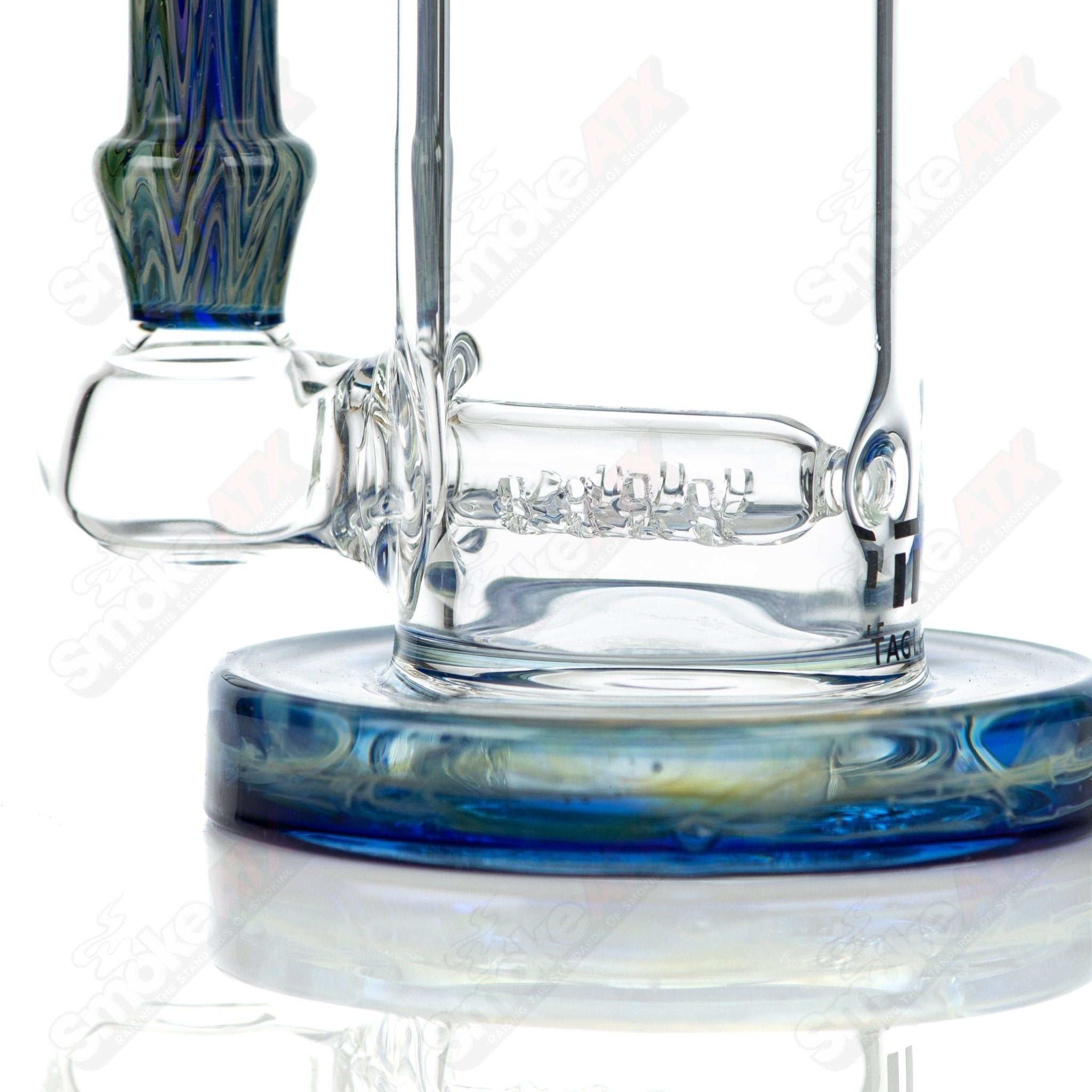 Tagle Glass inline tube bubbler with 18mm and 50mm wrap n rake design, clear glass with intricate textured details.