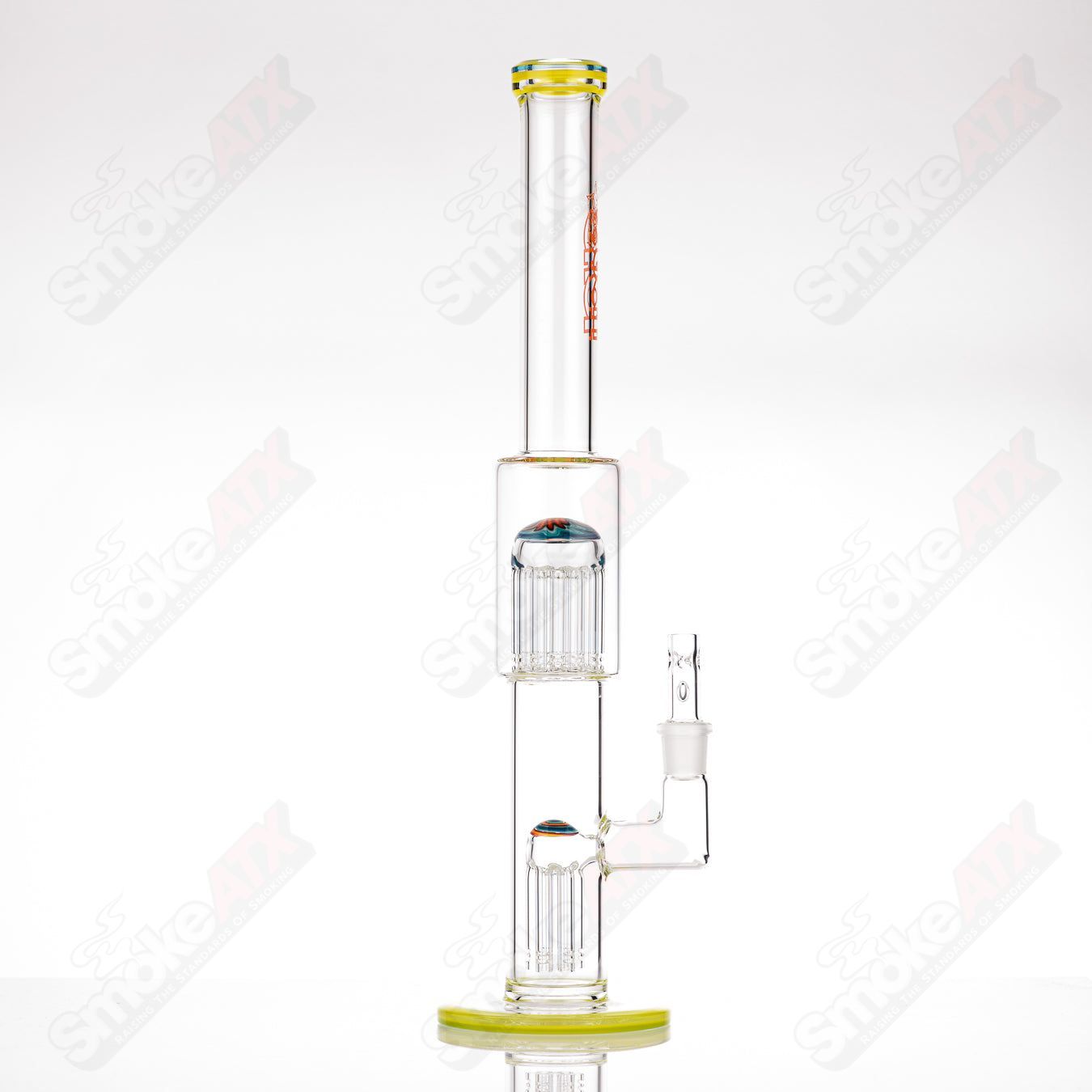 Toro glass straight tube with 18mm 7/13 arm perc and worked sections, showcasing intricate glasswork and clear design.