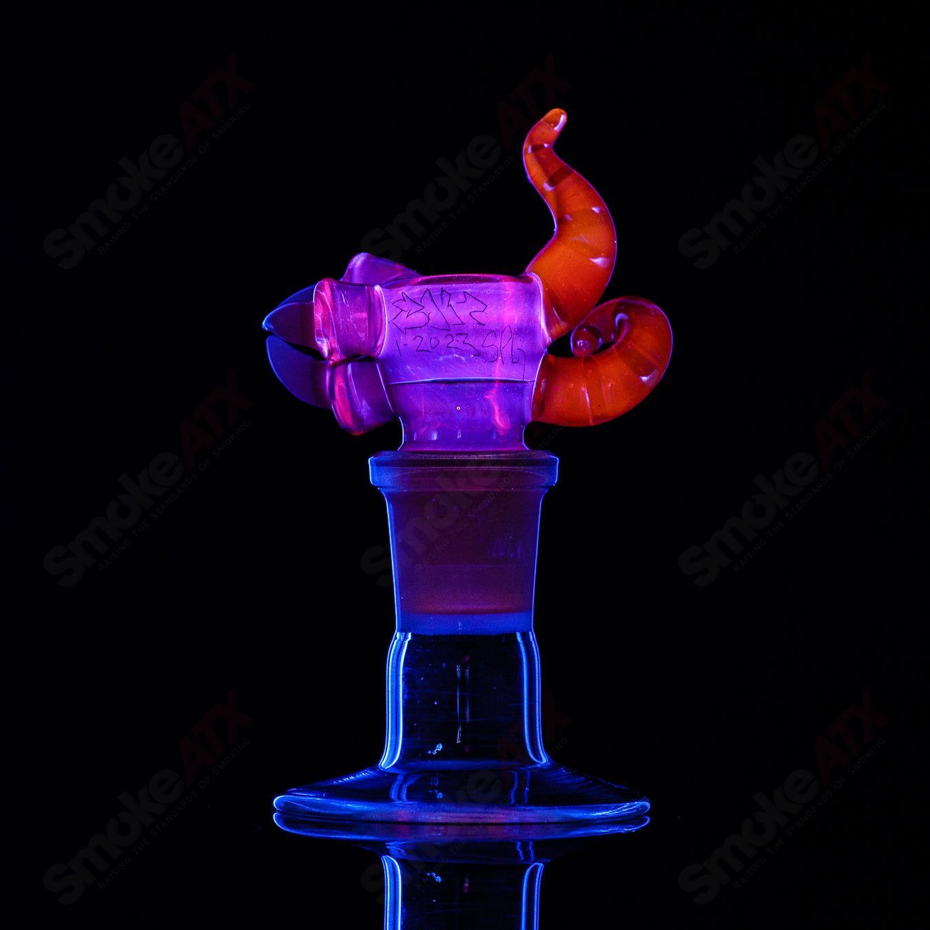 Salt Glass UV reactive 19mm 3-hole slide for heady glass bowls, featuring vibrant glow under UV light.