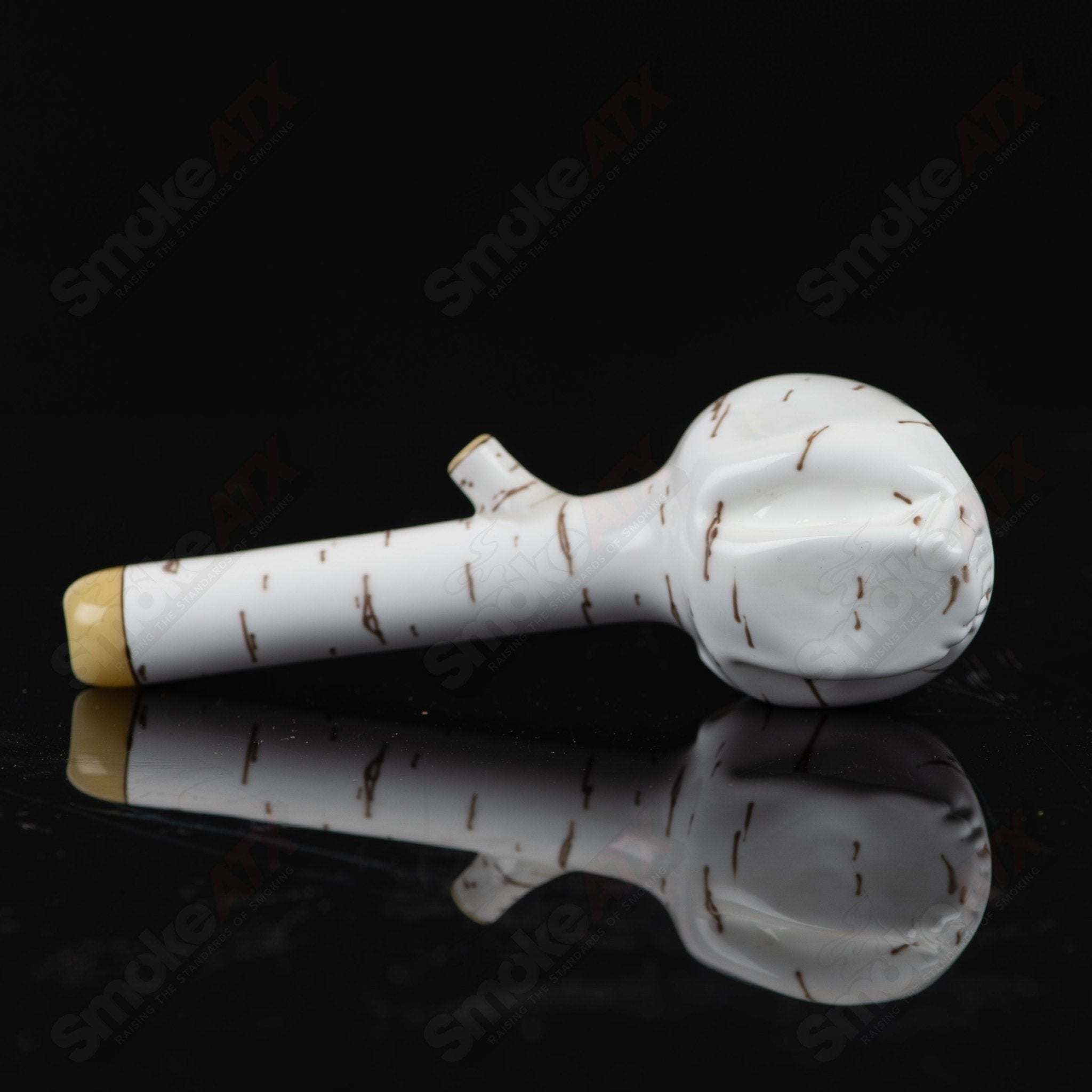 Foster Glass Heady Glass Skull Spoon pipe with birch design, featuring intricate details and a clear glass body.
