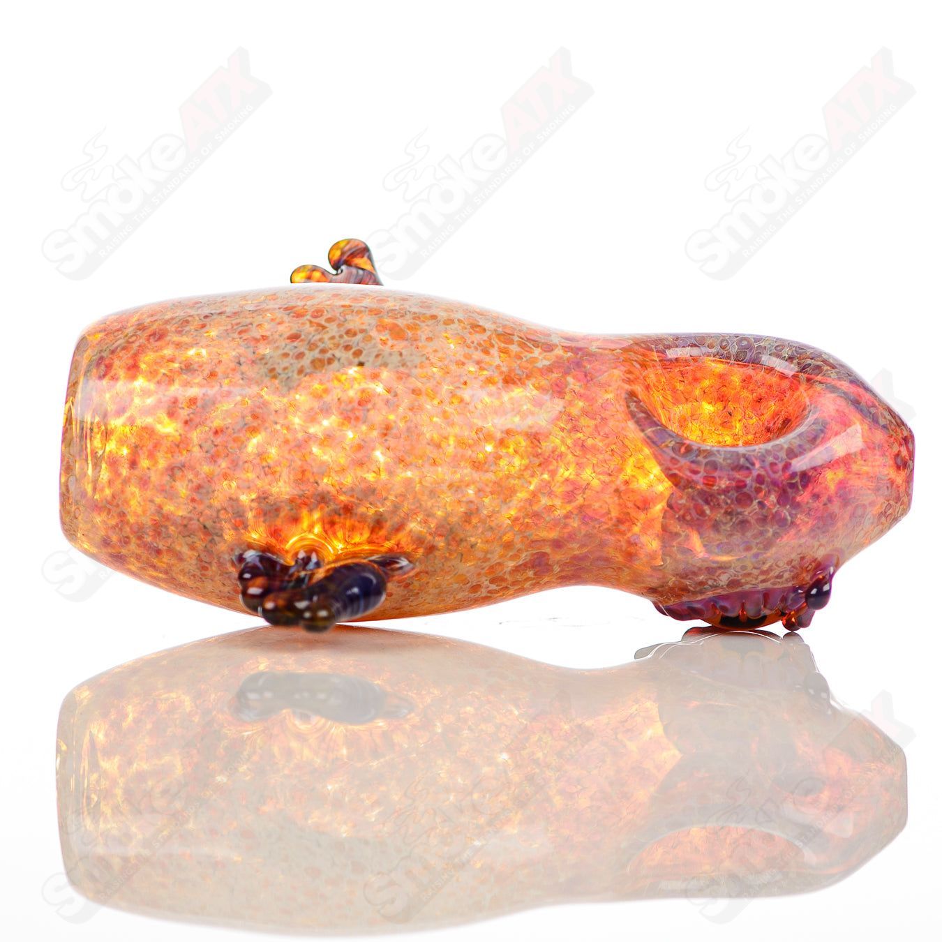 Colorful glass pipe with three hooters from Four Winds Flameworks, featuring intricate flameworked details and smooth curves.