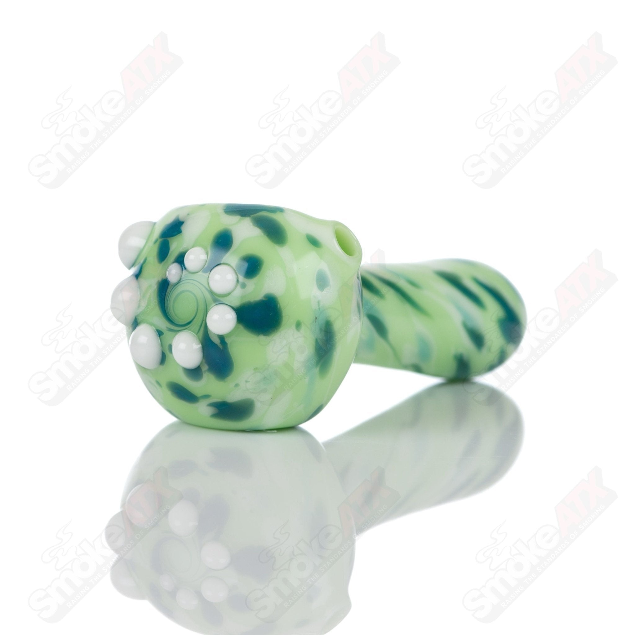 Colorful kiwi splatter glass spoon pipe by Adventures In Glass Blowing, showcasing intricate glass blowing craftsmanship.